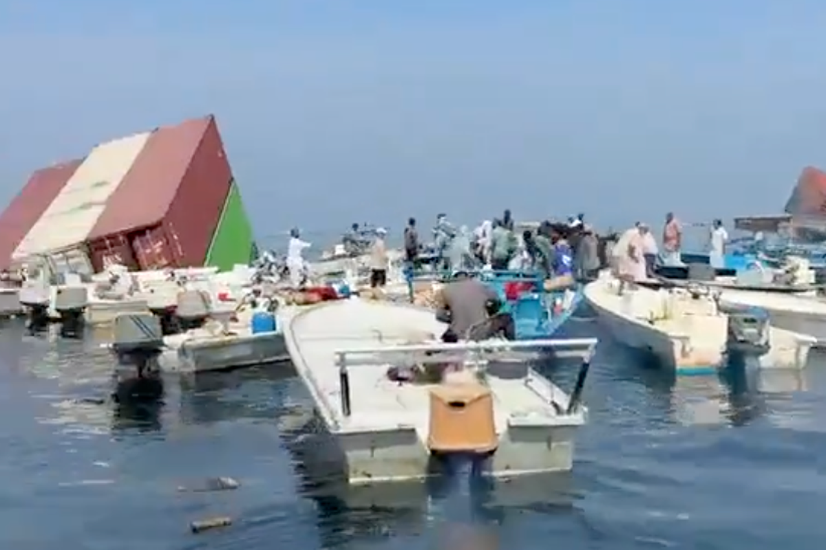Fishermen recover iPhones and perfume after container ship sinks in Strait of Hormuz