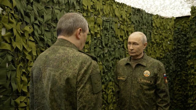 Putin listens to Russian military chief Valery Gerasimov at a command post at an undisclosed location on Friday, in a still image taken from a video released by the Kremlin