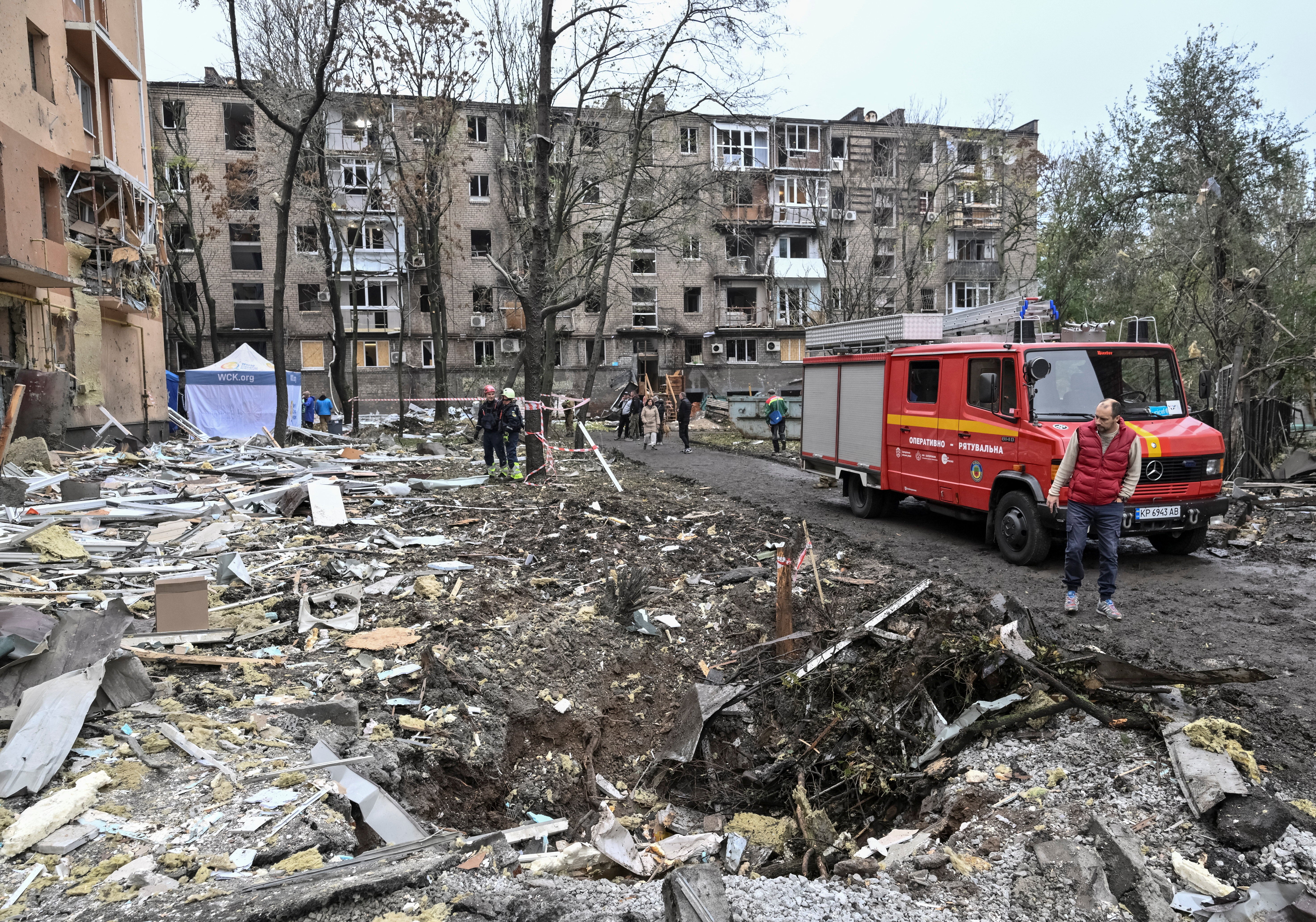 A resident looks at a crater that appeared at the site of an apartment building damaged during a Russian air strike, amid Russia's attack on Ukraine, in Zaporizhzhia, Ukraine, 17 October 2026