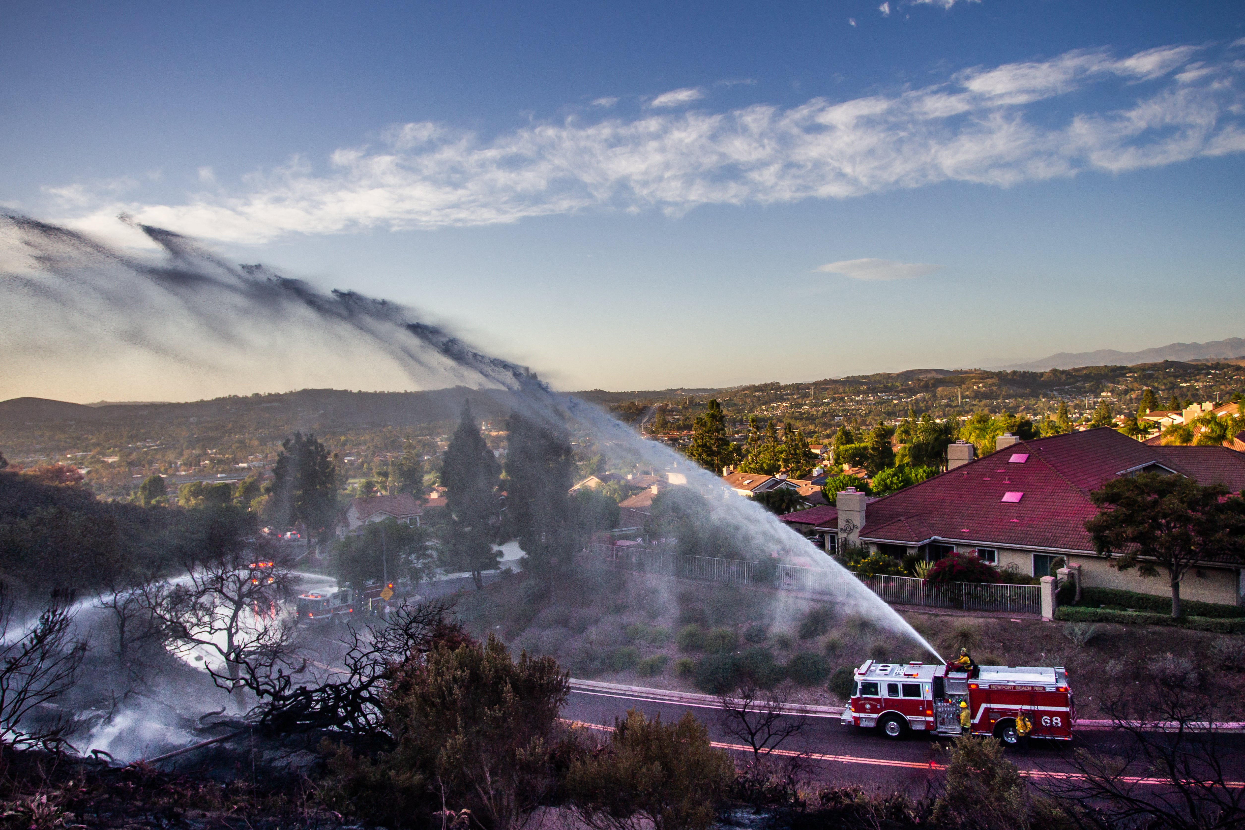 Firefighters battle the Norte Fire in San Juan Capistrano, California