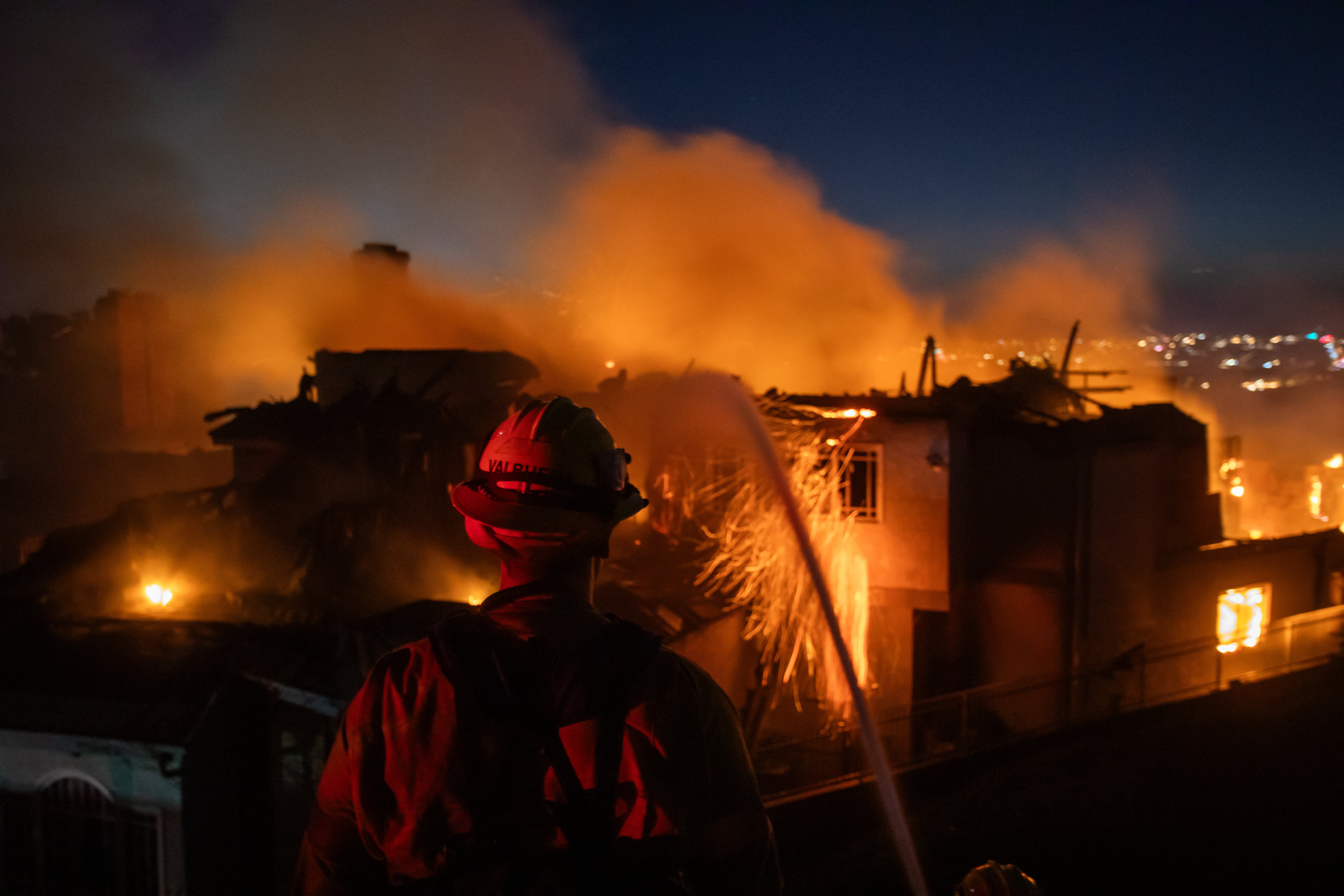 Wildfire forces thousands to evacuate as blaze destroys coastal homes