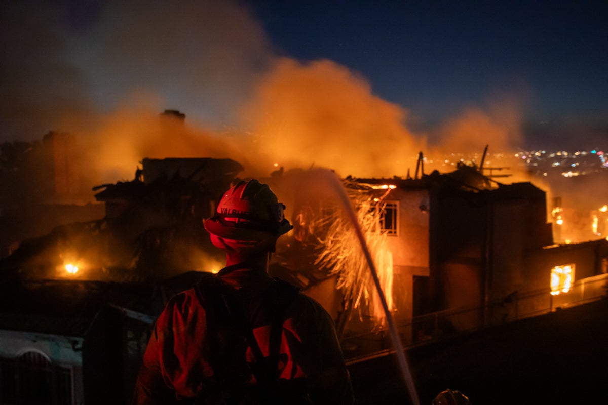 California wildfire forces thousands to evacuate as blaze destroys coastal homes