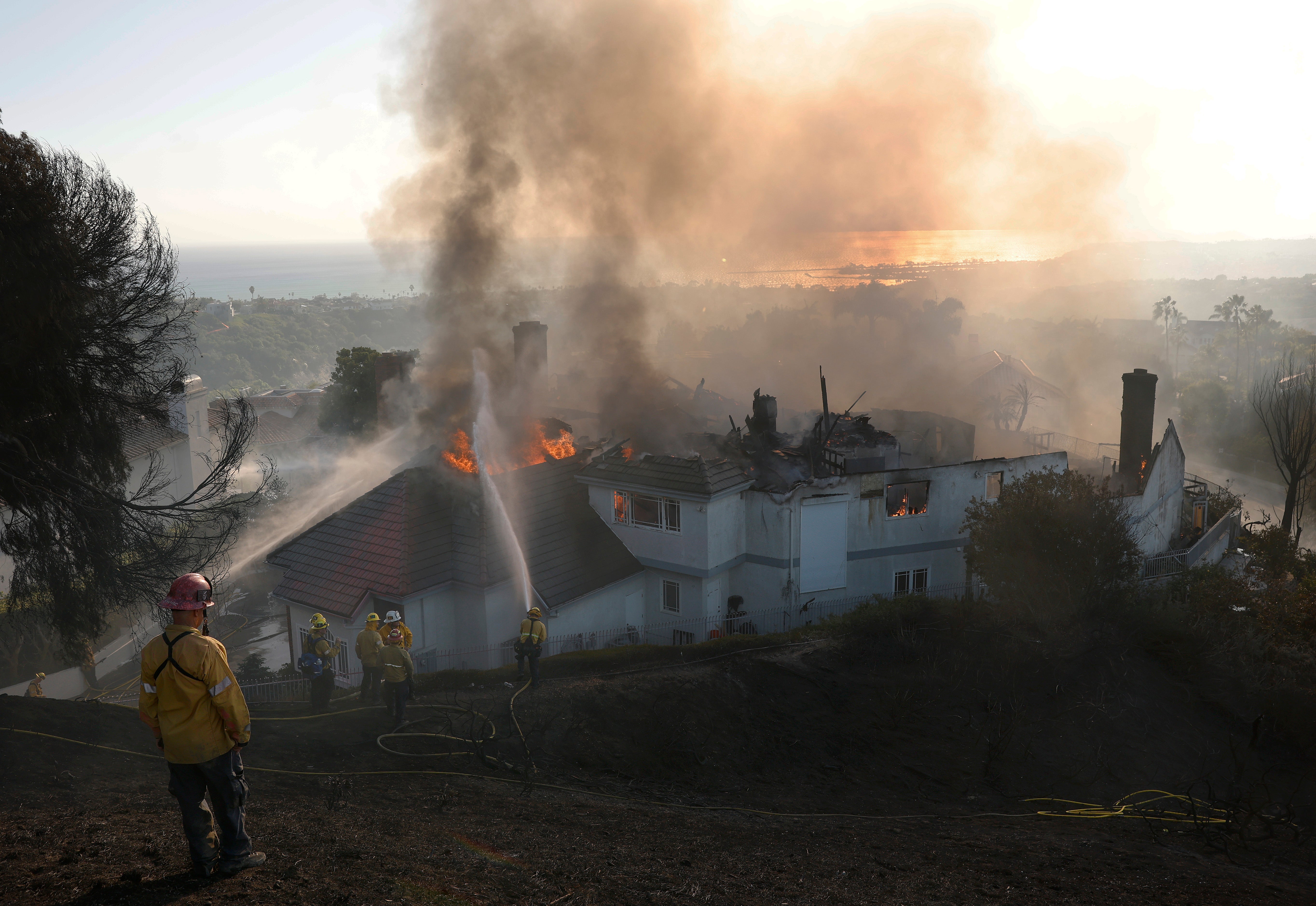The Norte Fire has burned nearly 500 acres and destroyed multiple structures in a matter of hours, as high winds have aggressively pushed it into neighborhoods