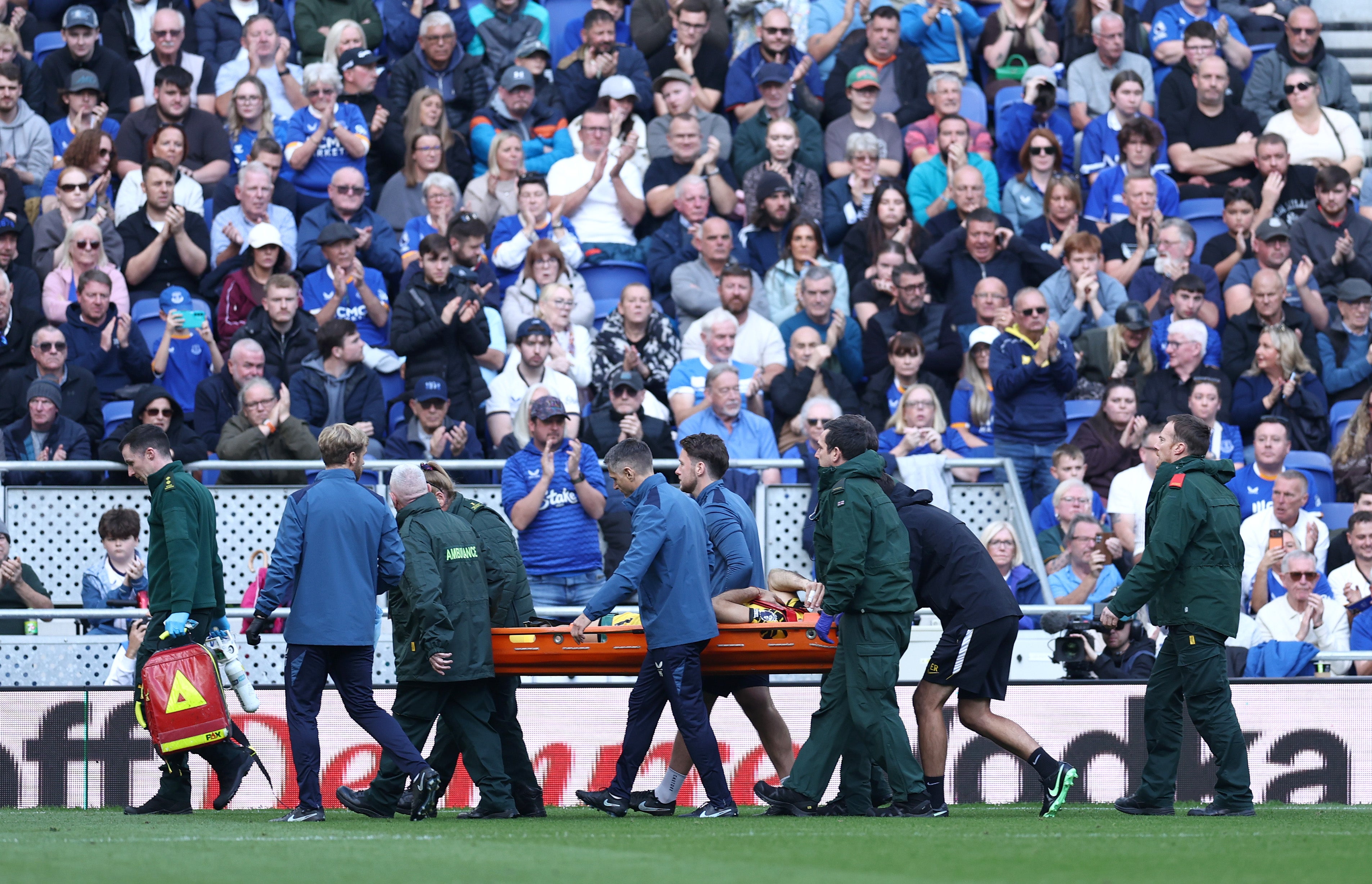 Martinez was stretchered off the pitch following around 10 minutes of treatment