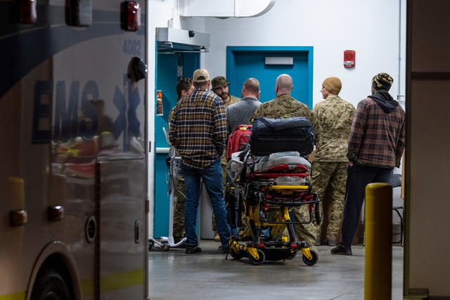 Emergency crews and military personnel are seen at the Wainwright Health Centre Saturday as injured military members are treated for their injuries