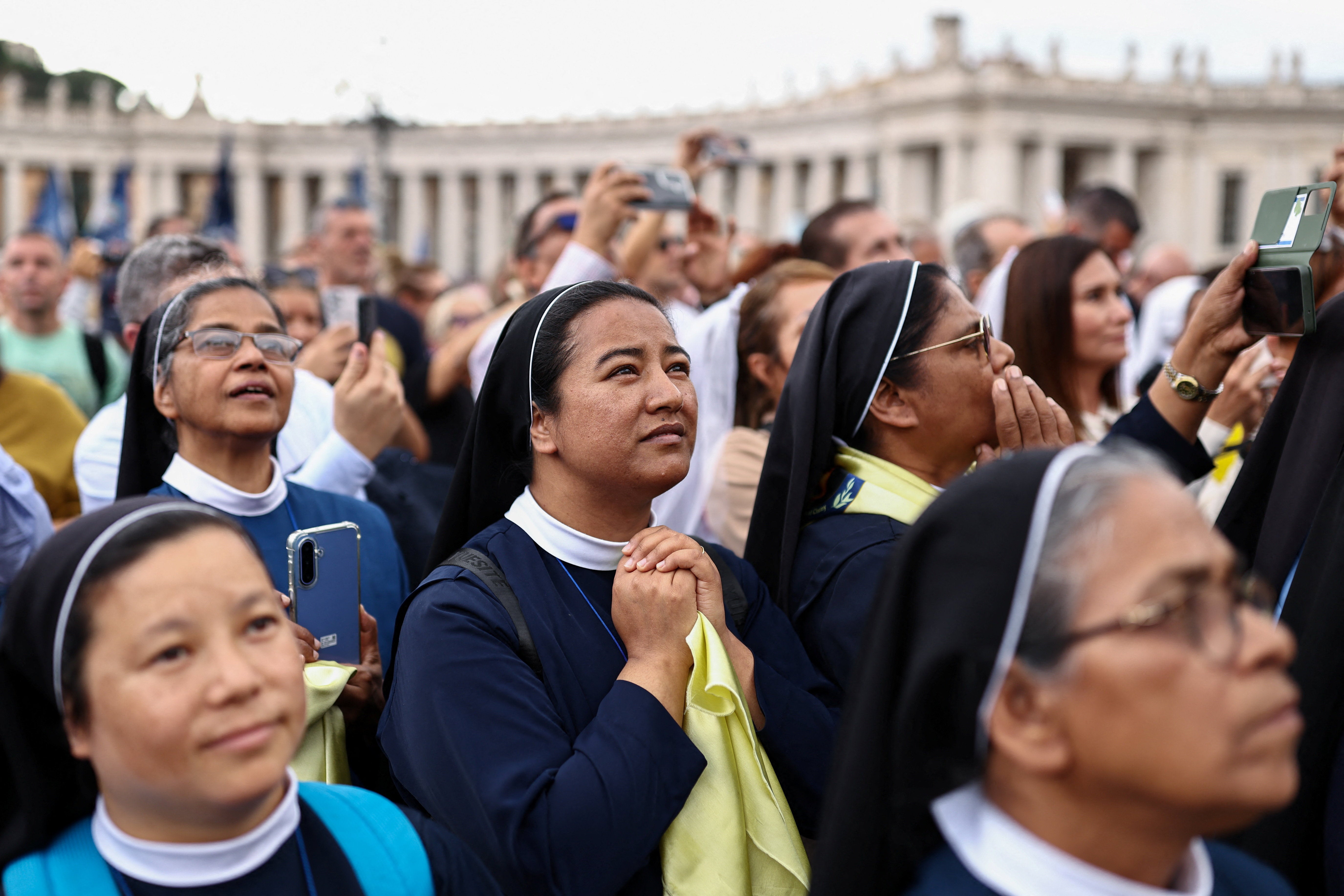 Faithful gather in St. Peter's Square as Pope Leo leads the Angelus prayer from a window of the Apostolic Palace, following his discharge from hospital after surgery for lung cancer, at the Vatican