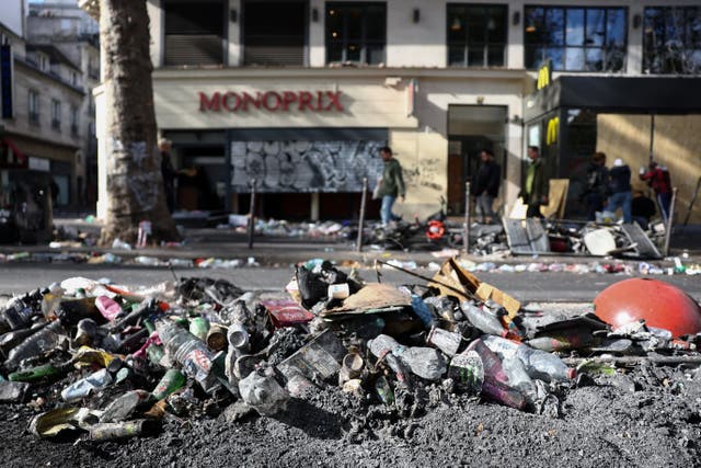 Ashes and rubbish on the side of a street, the day after clashes during a national day of demonstrations