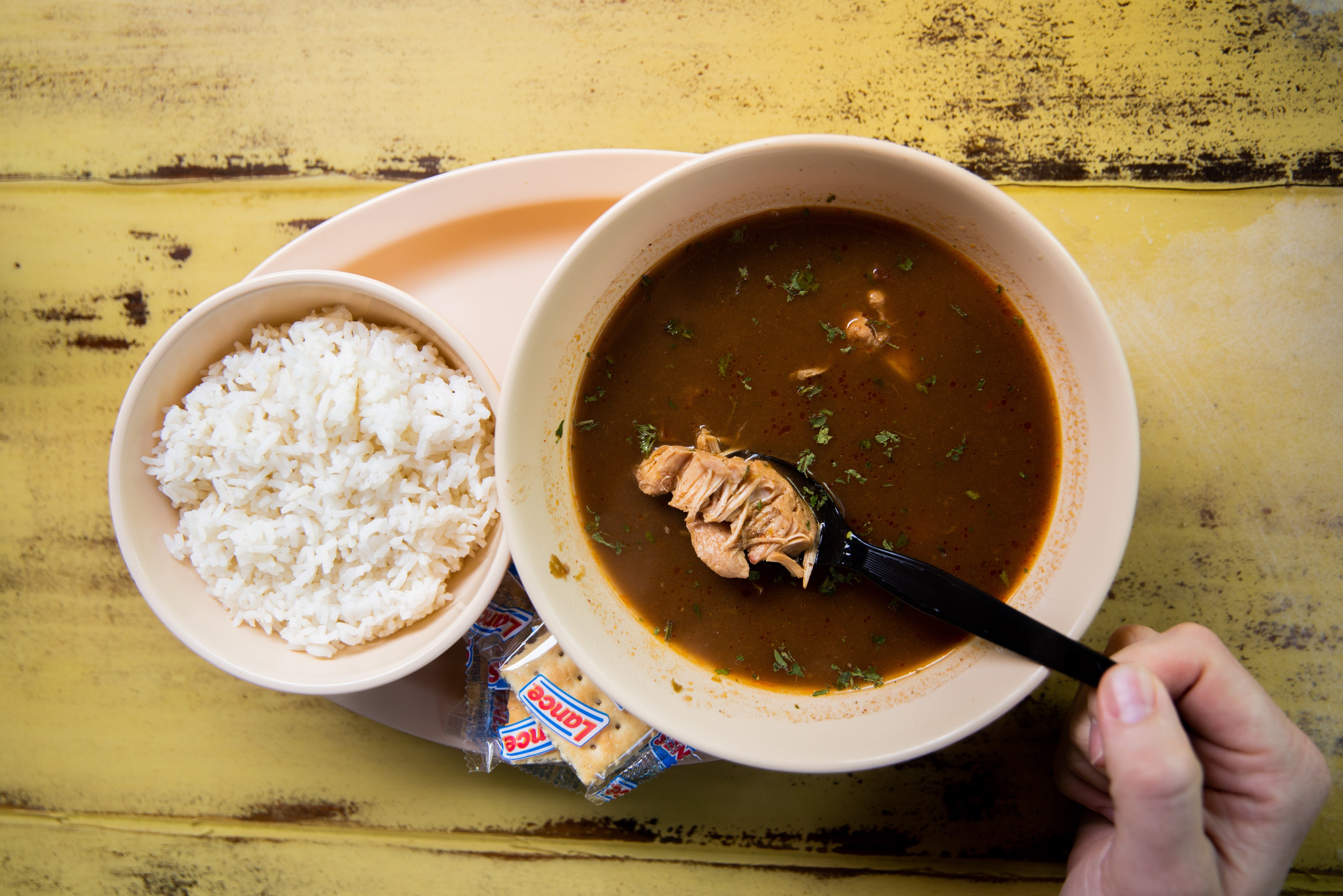 Gumbo in Lake Charles served with rice and saltine crackers
