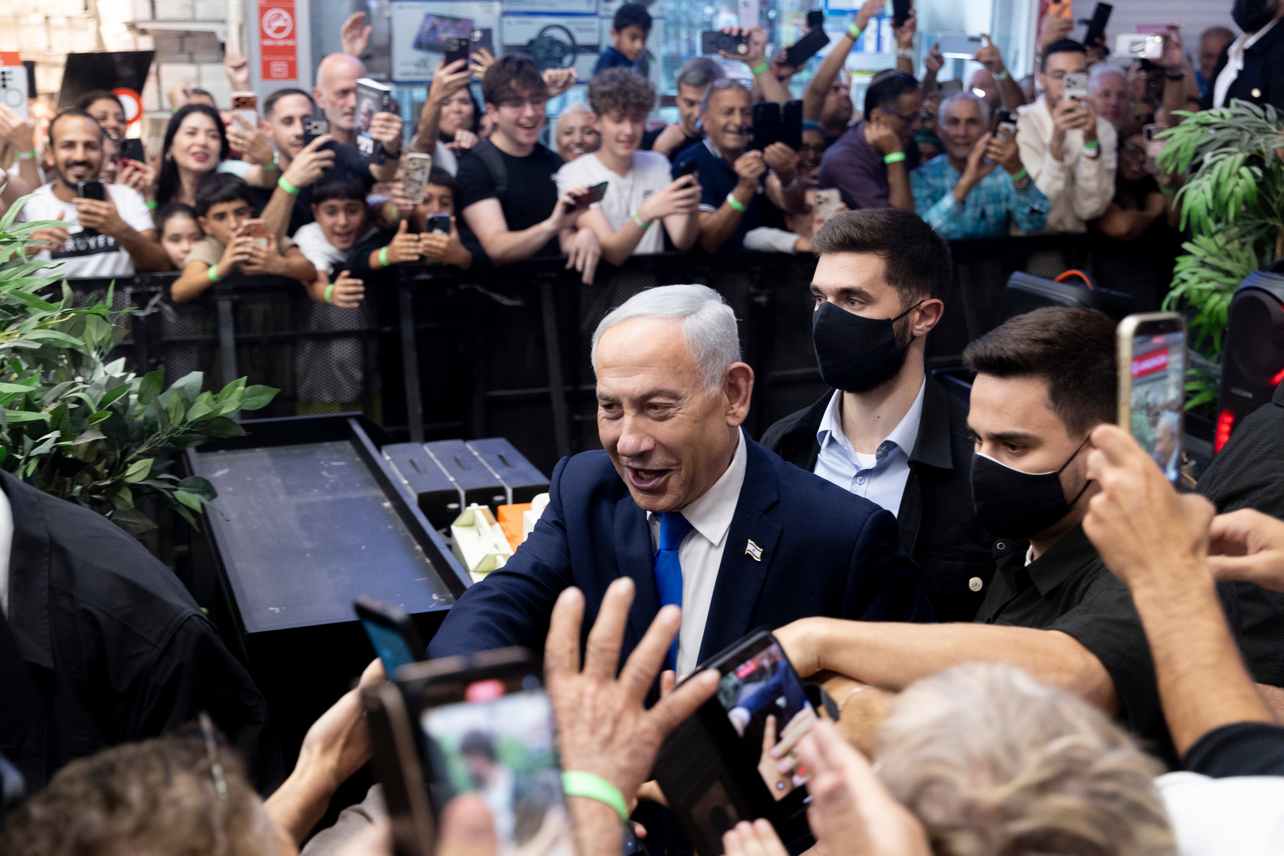 Israeli Prime Minister and Likud Party leader, Benjamin Netanyahu, greets supporters, during a campaign event at a mall ahead of Israel's general elections scheduled for next week on October 18, 2026 in Yoqne'am Israel