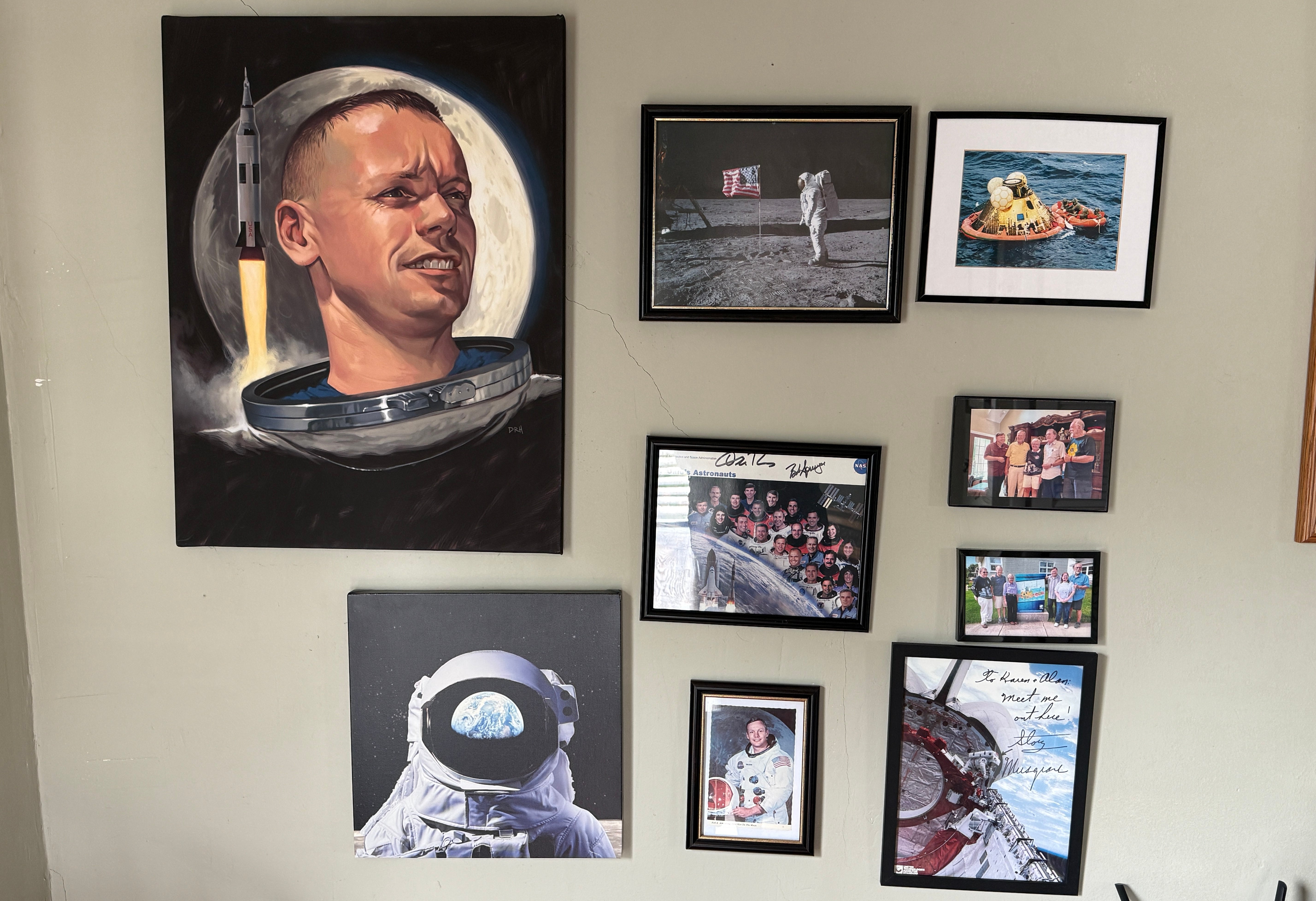 A wall of portraits and photos hang inside the former bedroom of Neil Armstrong