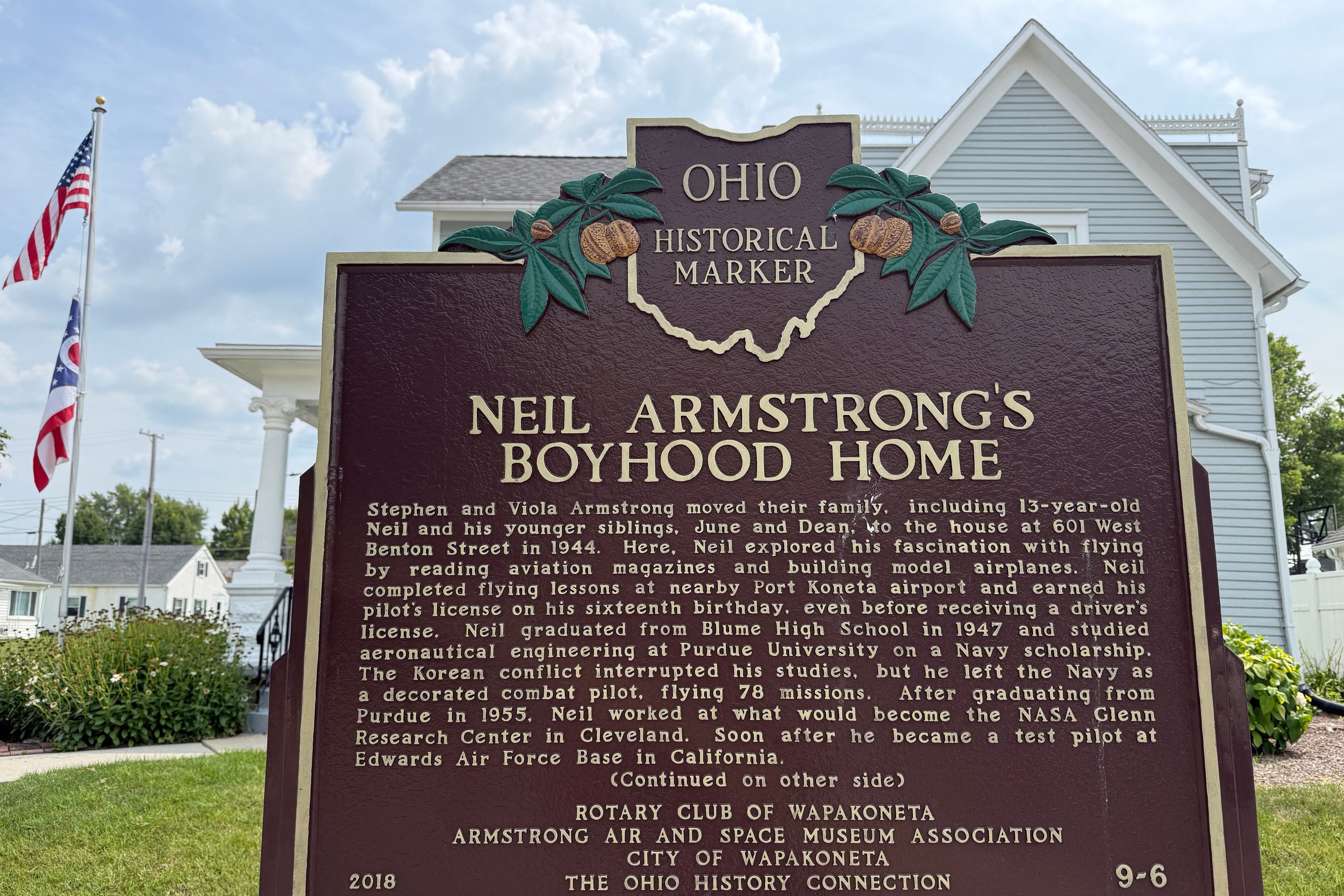 An Ohio historical landmark sign is displayed outside the former home of Neil Armstron