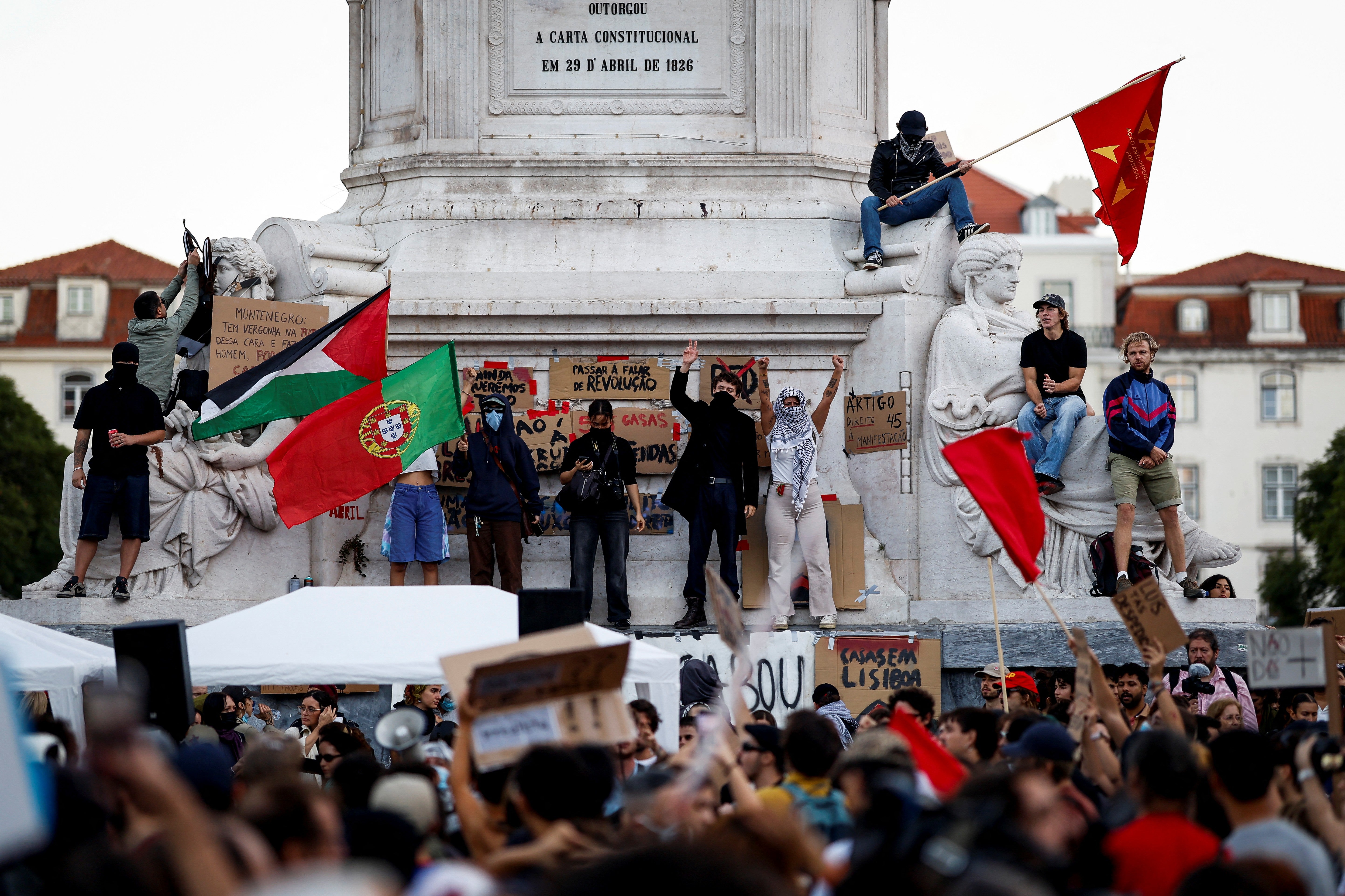 Demonstrators protest against housing shortage, soaring rents and low wages on Rossio square in central Lisbon on October 17