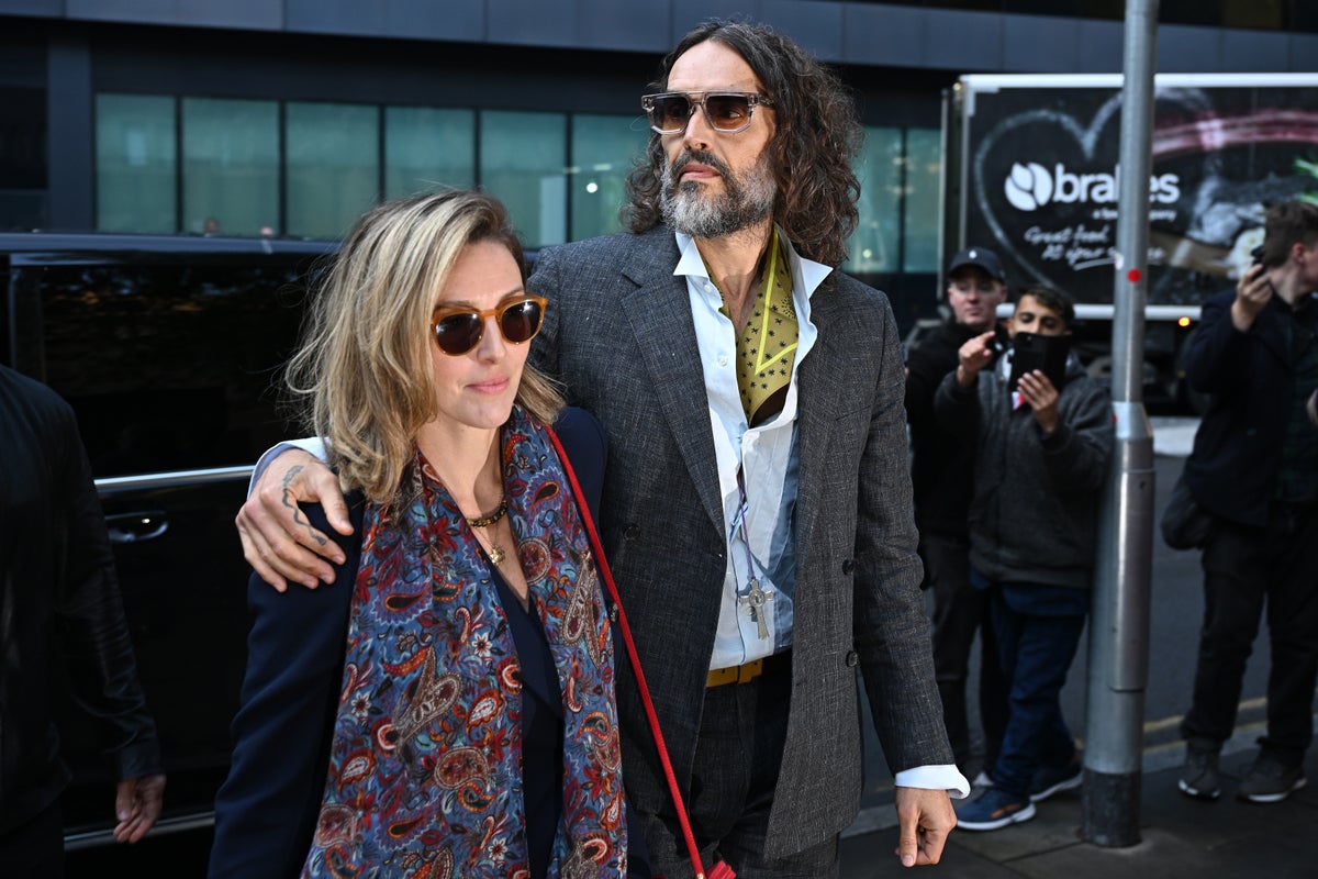 Russell Brand had ‘big grin’ as he grabbed woman’s breasts and dragged her into toilet and raped her, woman claims