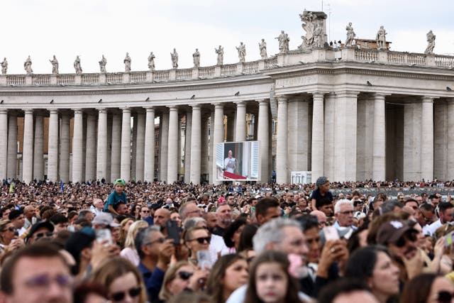 Faithful gather in St. Peter's Square as Pope Leo leads the Angelus prayer from a window of the Apostolic Palace, following his discharge from hospital after surgery for lung cancer, at the Vatican, October 18, 2026