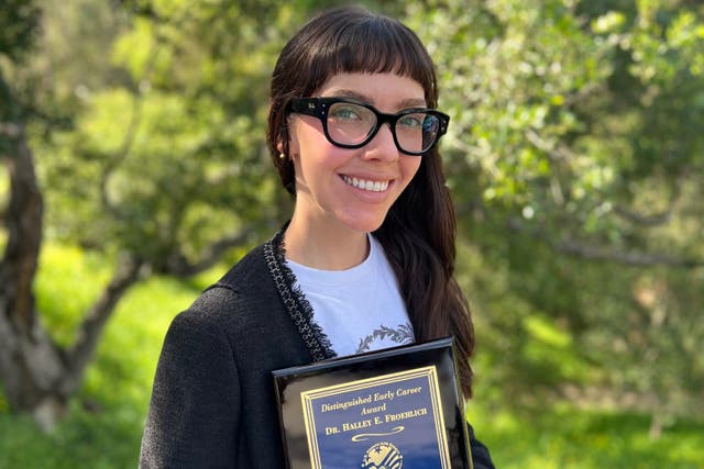 This photo, provided by Halley Froehlich, shows Froehlich holding a U.S. Aquaculture Society award in Santa Barbara