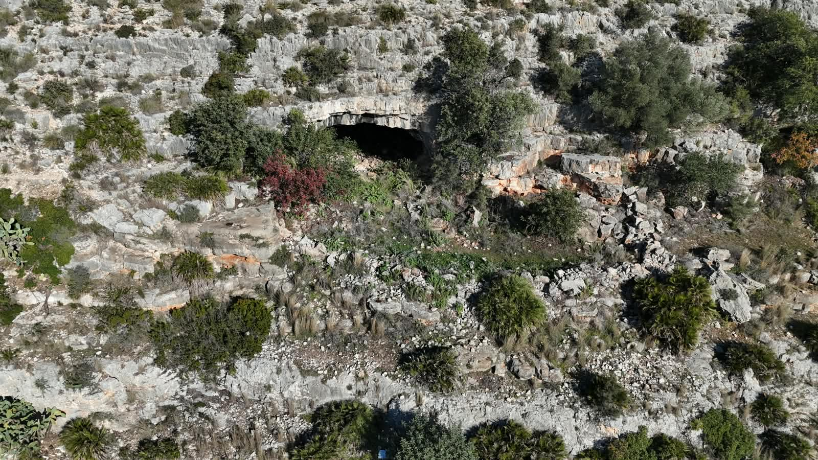 The entrance way to the women’s cave, in the side of a rugged canyon, is remote and inconspicuous - and yet the cave complex, lying behind it, has been repeatedly of huge cultural importance over a period of some 24,000 years, arguably making it one of the most culturally significant places on earth