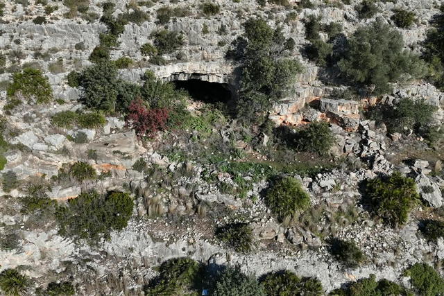 The entrance way to the women’s cave, in the side of a rugged canyon, is remote and inconspicuous - and yet the cave complex, lying behind it, has been repeatedly of huge cultural importance over a period of some 24,000 years, arguably making it one of the most culturally significant places on earth