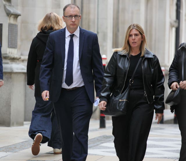 Justin and Karen Salmon outside Mayors and City County Court after hearing in dispute over 'man cave'