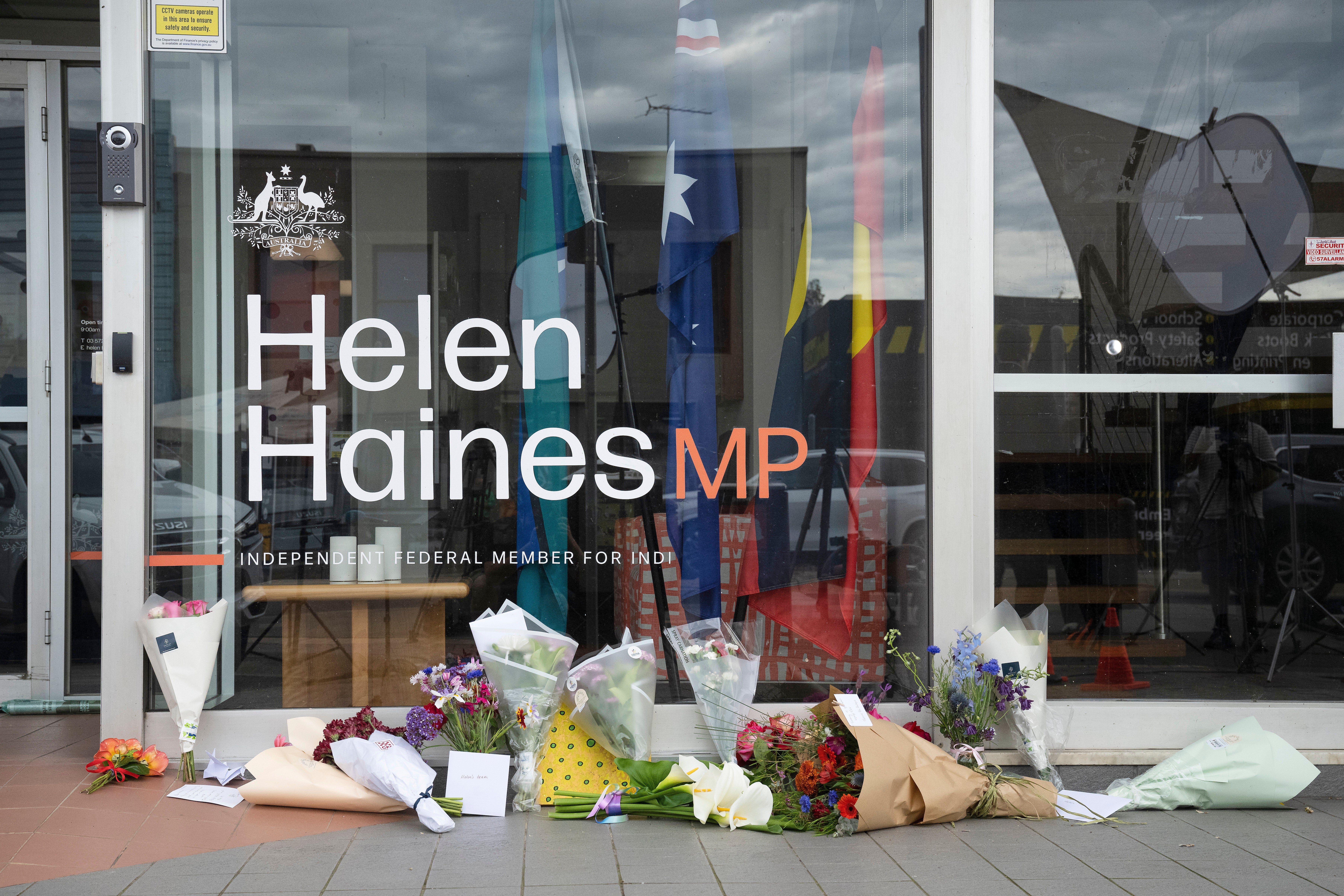 Tributes and flowers are placed outside the electoral office for independent member of parliament Helen Haines in Wangaratta, Australia, Tuesday, 20 October 2026