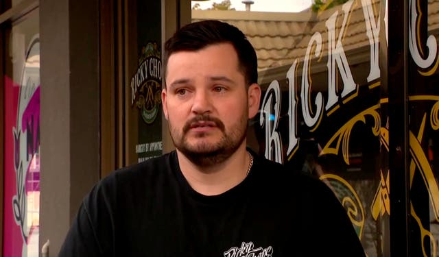 Australian barber Ricky Jefferies, who ran out of his store to detain a man who authorities allege deliberately drove a car into Australian lawmaker Helen Haines, speaks in Wangaratta