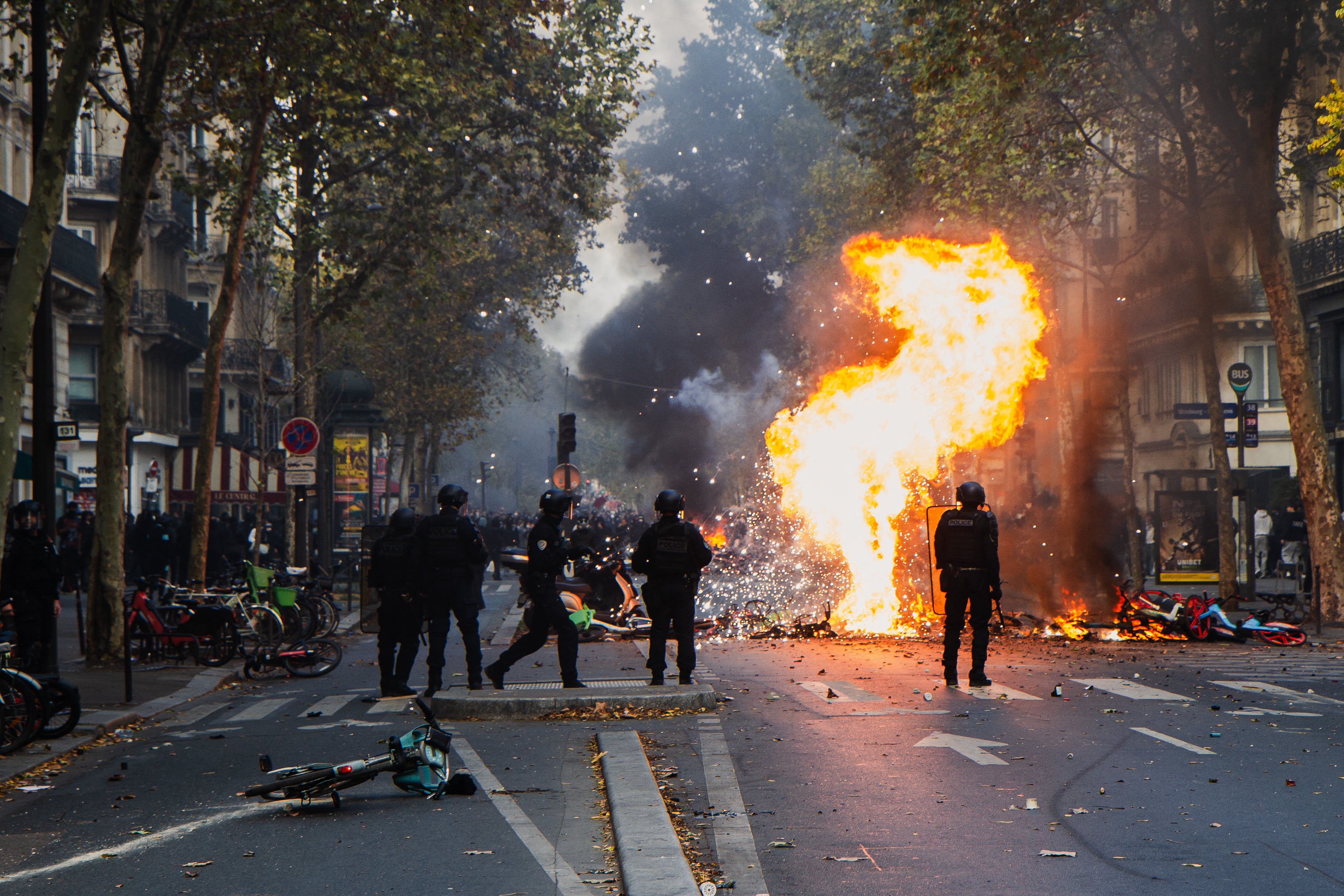 A group of police officers facing rioters and looters in Paris on October 17