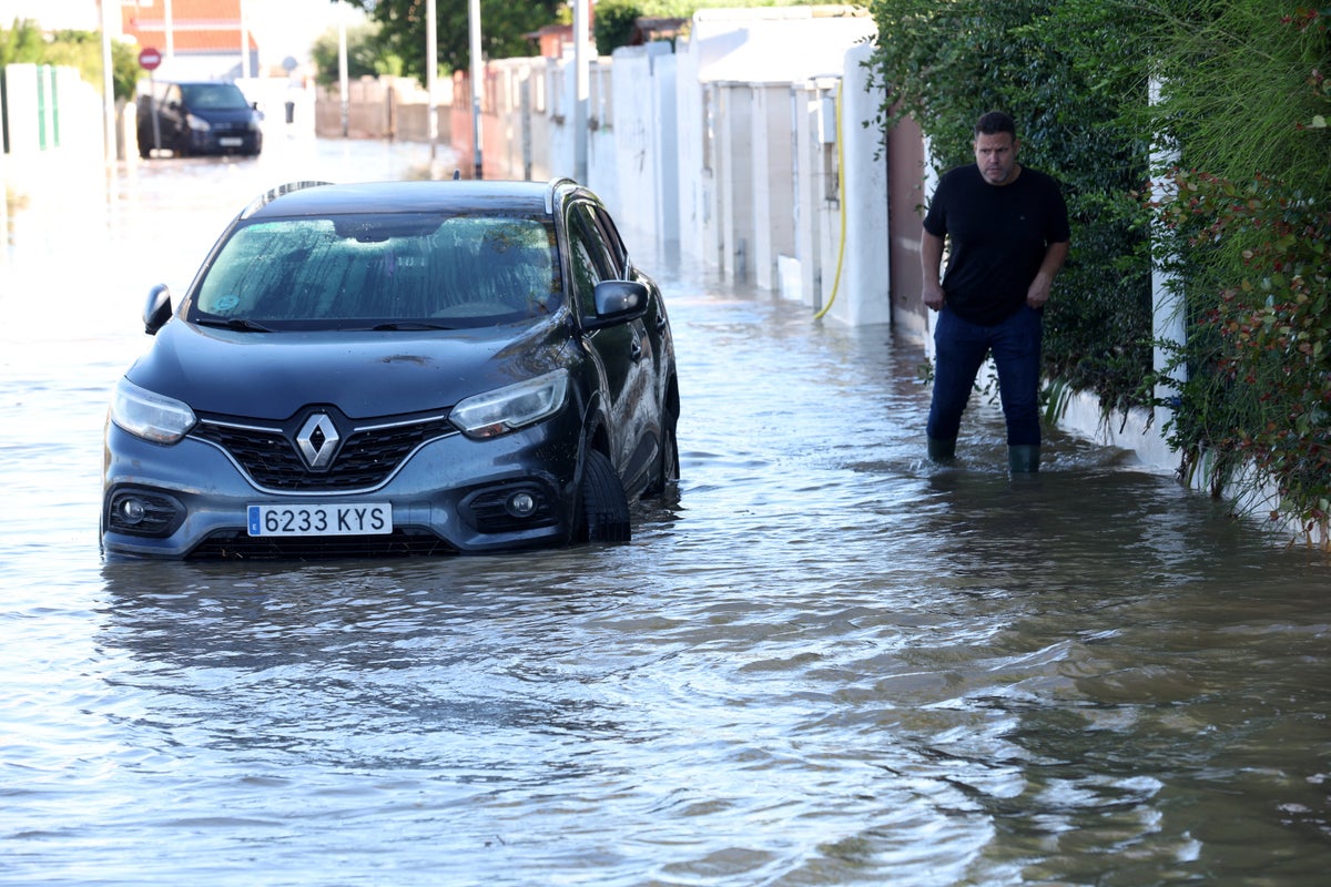 Three dead as Storm Adam brings severe flooding and travel chaos to Spain