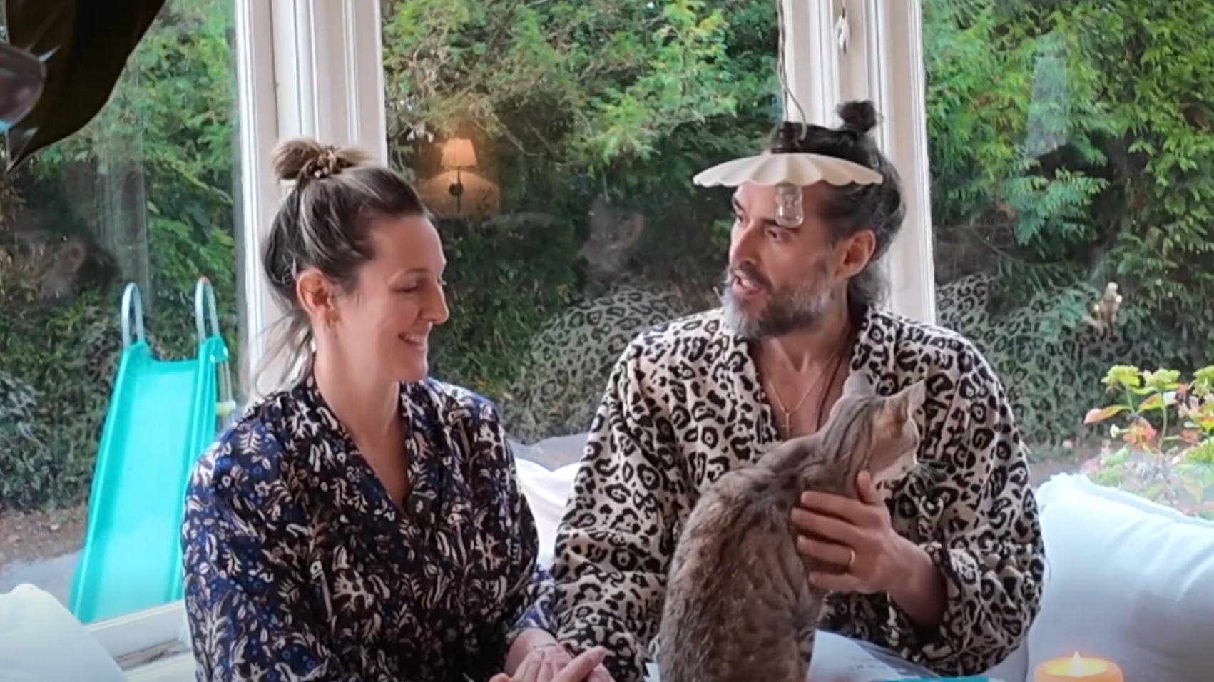 On trial for rape, Russell Brand is still delivering hour-long podcasts in pyjamas