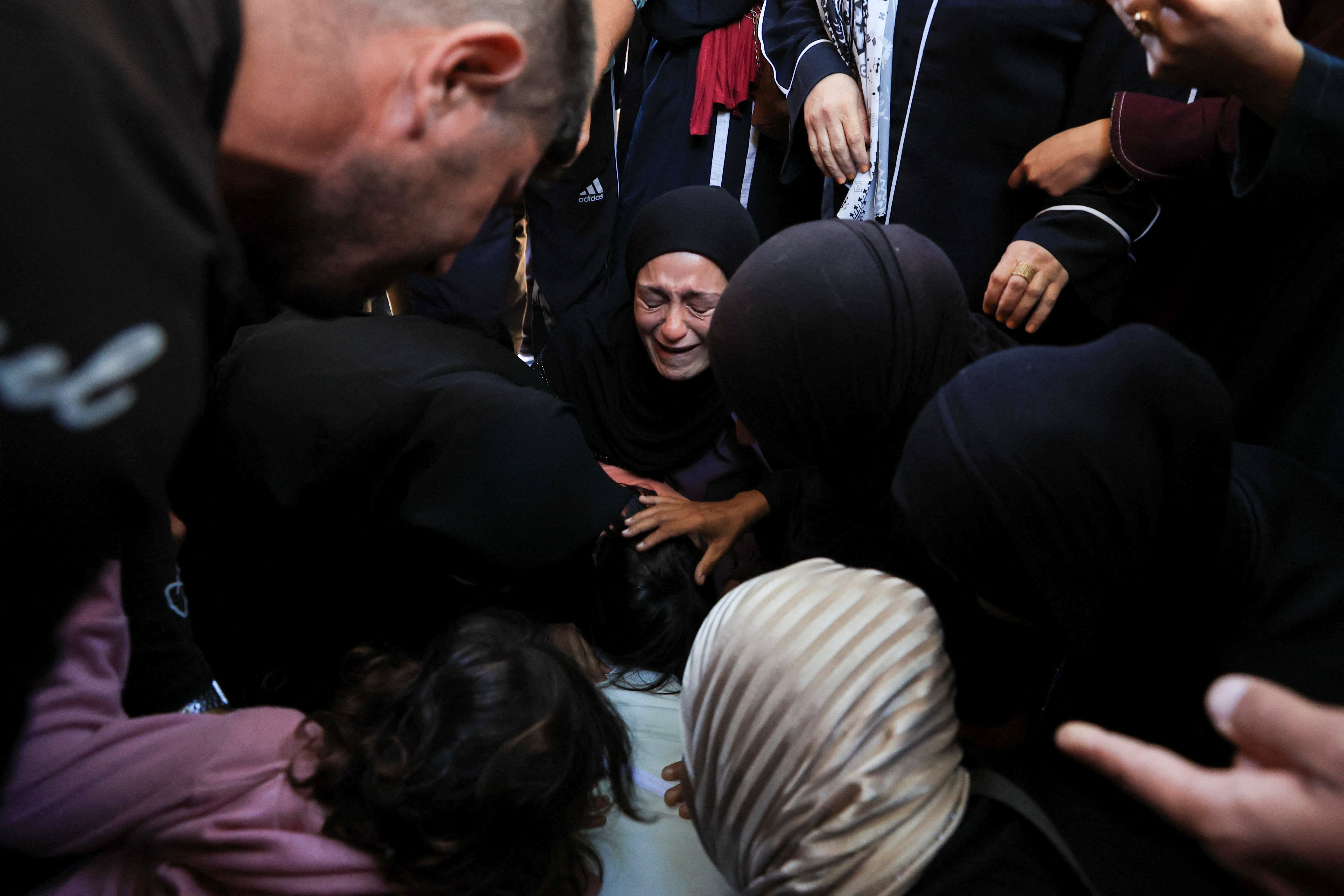 Mourners react during the funeral of Palestinian Tamer Al-Sabagh, who was killed in an Israeli strike yesterday, in Gaza City, October 20, 2026