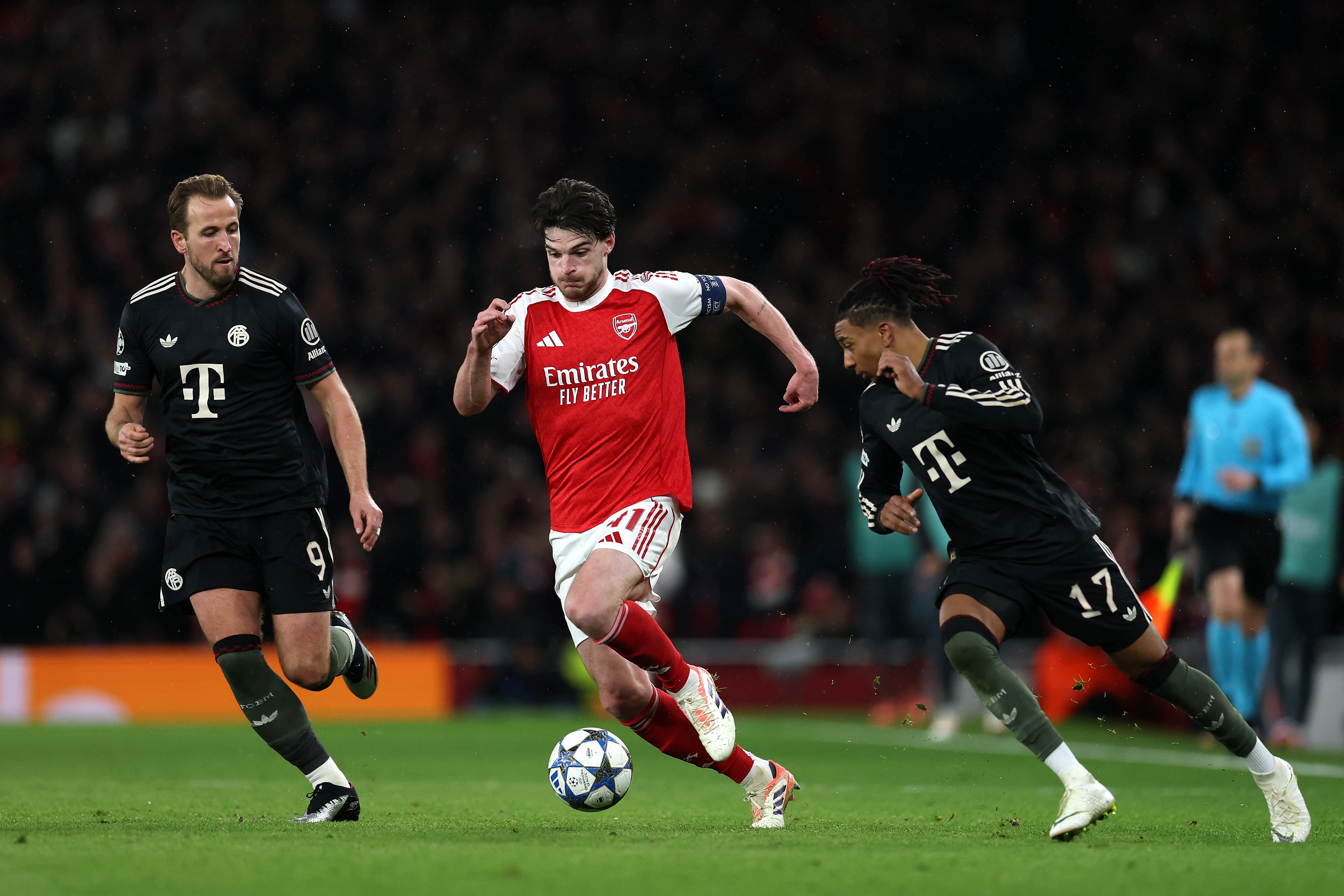 Declan Rice of Arsenal is challenged by Harry Kane and Michael Olise in last season's Champions League