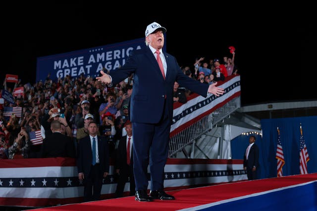 During another disruption later that night, Trump said, 'Don’t hurt them,' but then mimicked wanting to punch them — a callback to his first presidential campaign in 2016 when he encouraged his supporters in Iowa to 'knock the crap out of' anyone preparing to throw tomatoes
