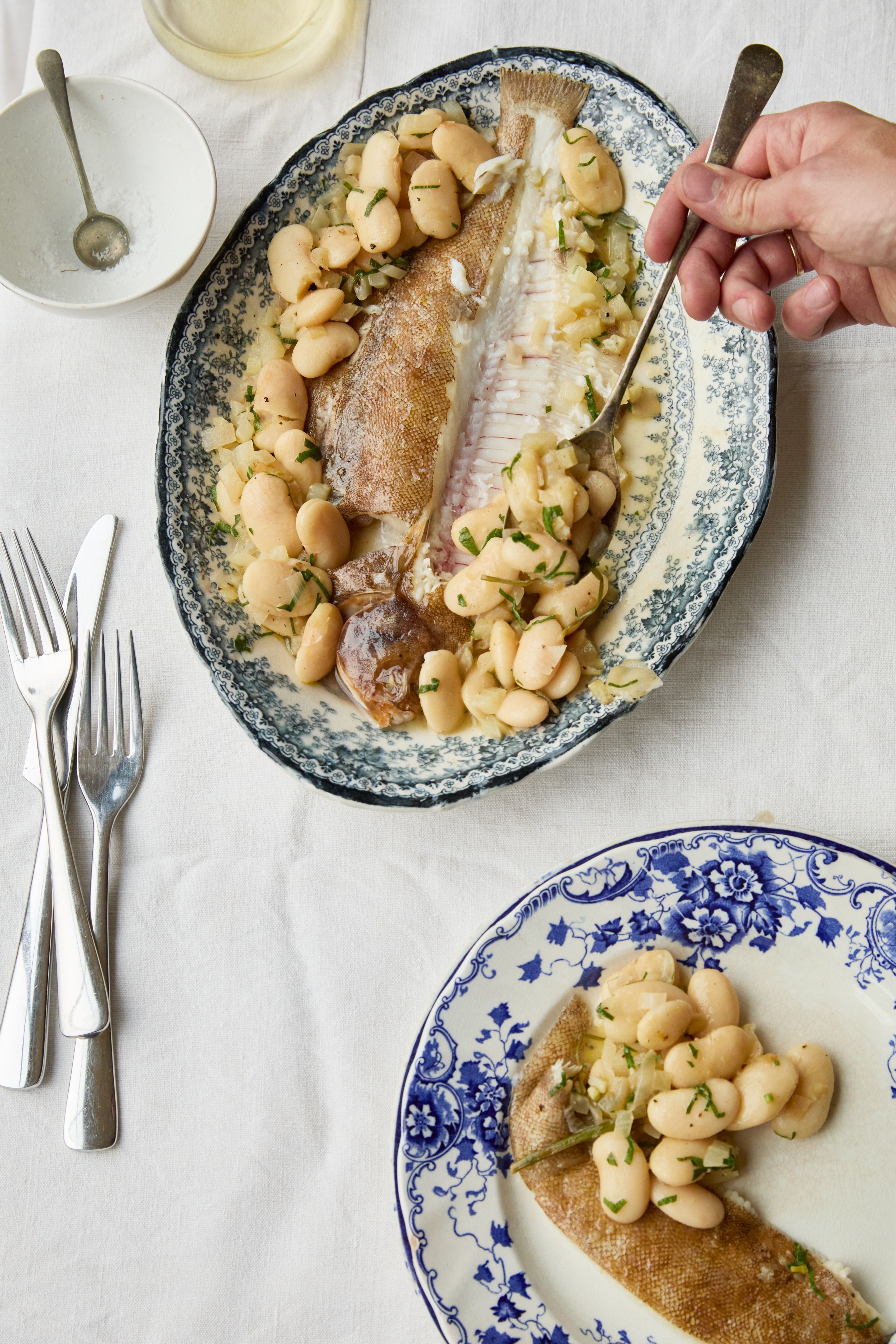 Delicate lemon sole meets creamy butter beans in a simple dish that makes the most of the whole fish