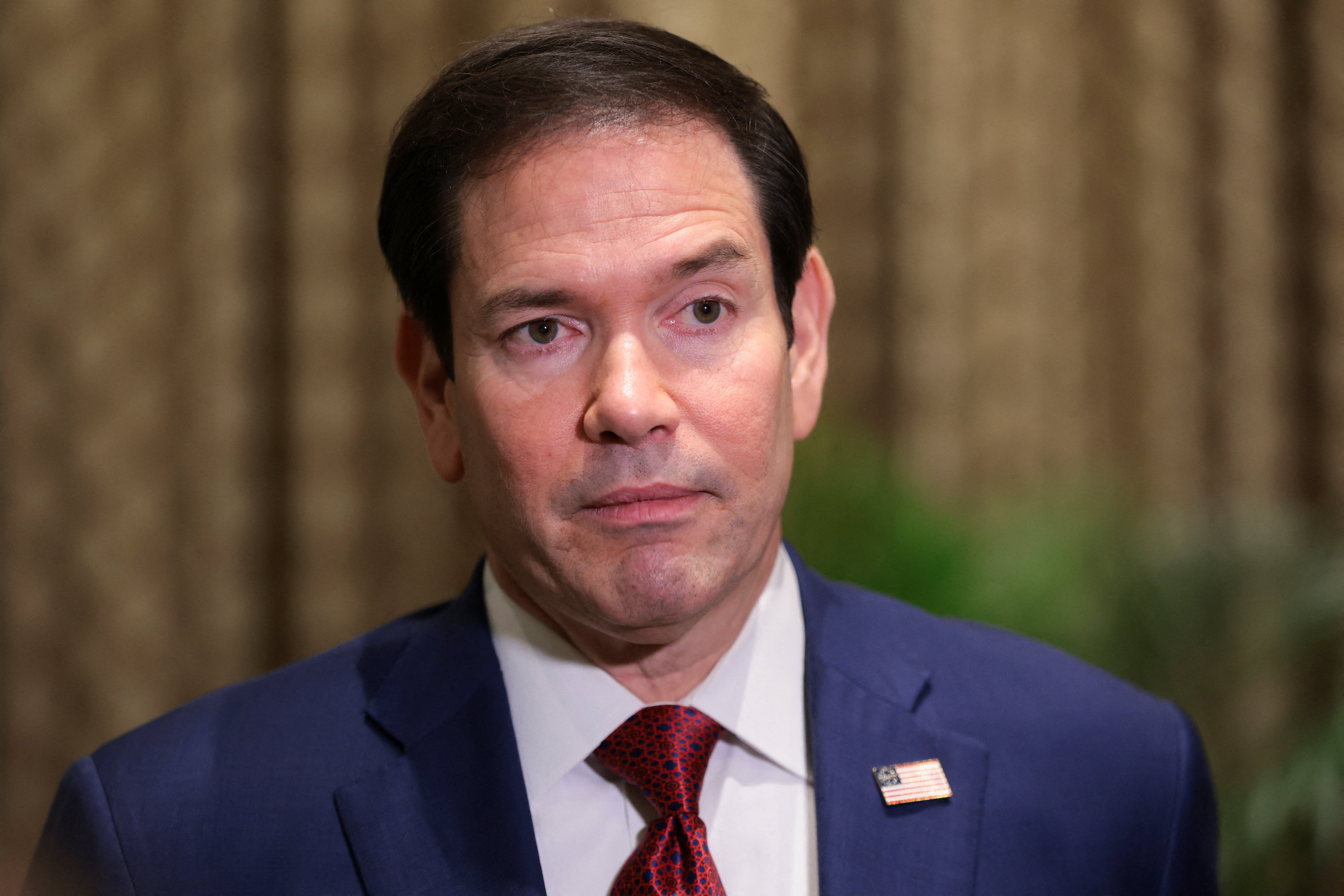 Secretary of State Marco Rubio looks on as he speaks with members of the media at the Taj Mahal Palace hotel in Mumbai, India, October 21