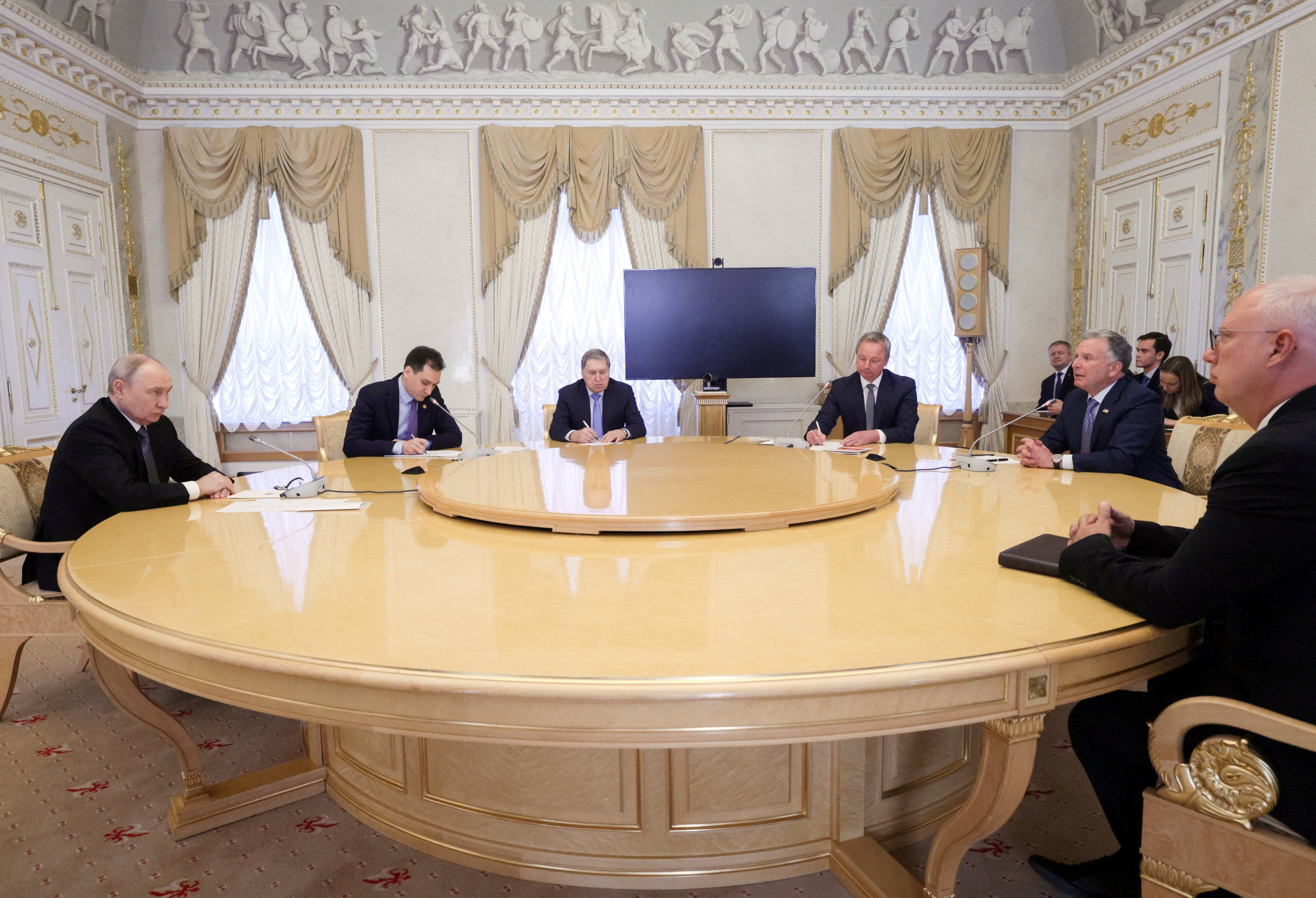 Vladimir Putin, US special envoy Steve Witkoff and other officials attend a meeting at the Constantine Palace on Wednesday