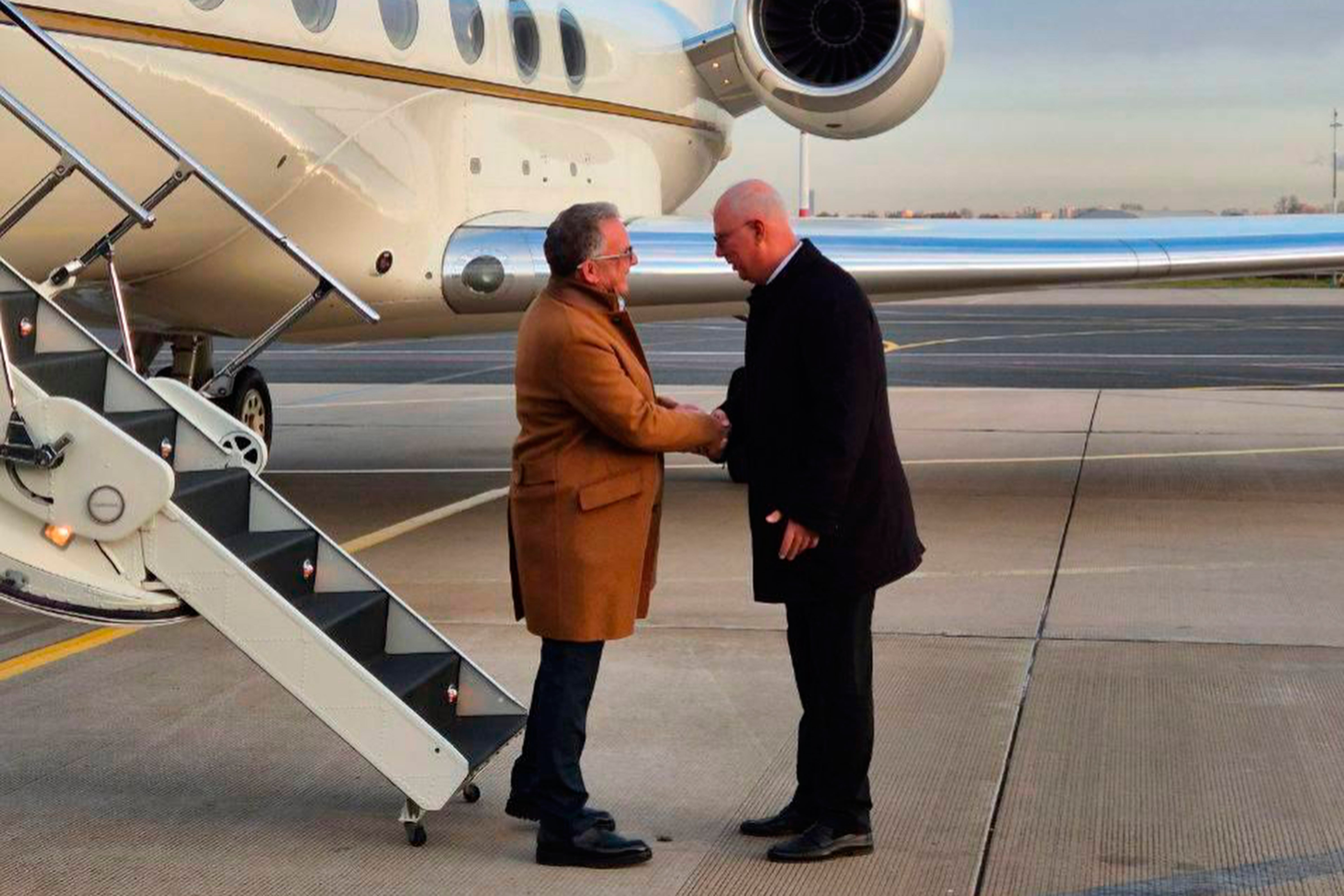 Russian presidential envoy Kirill Dmitriev, right, greets U.S. special envoy Steve Witkoff on Wednesday