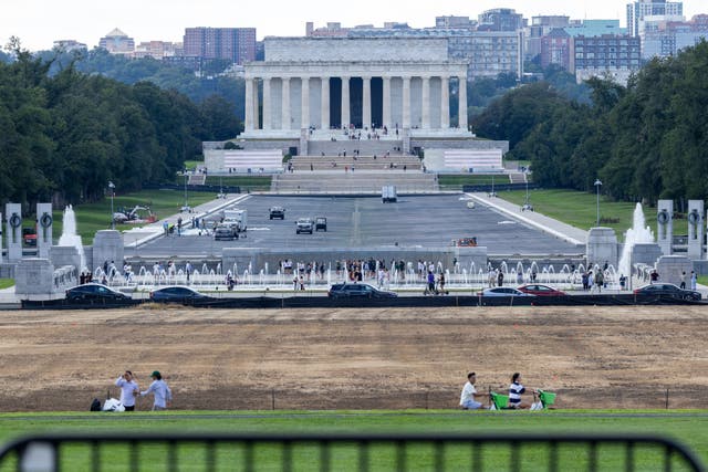 Workers re-coat the base of the Lincoln Memorial Reflecting Pool on Sept. 8, 2026 in Washington, DC