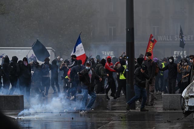 Protesters confront police during a demonstration against rising living costs and in support of students’ grievances in Paris, Saturday, Oct. 17, 2026