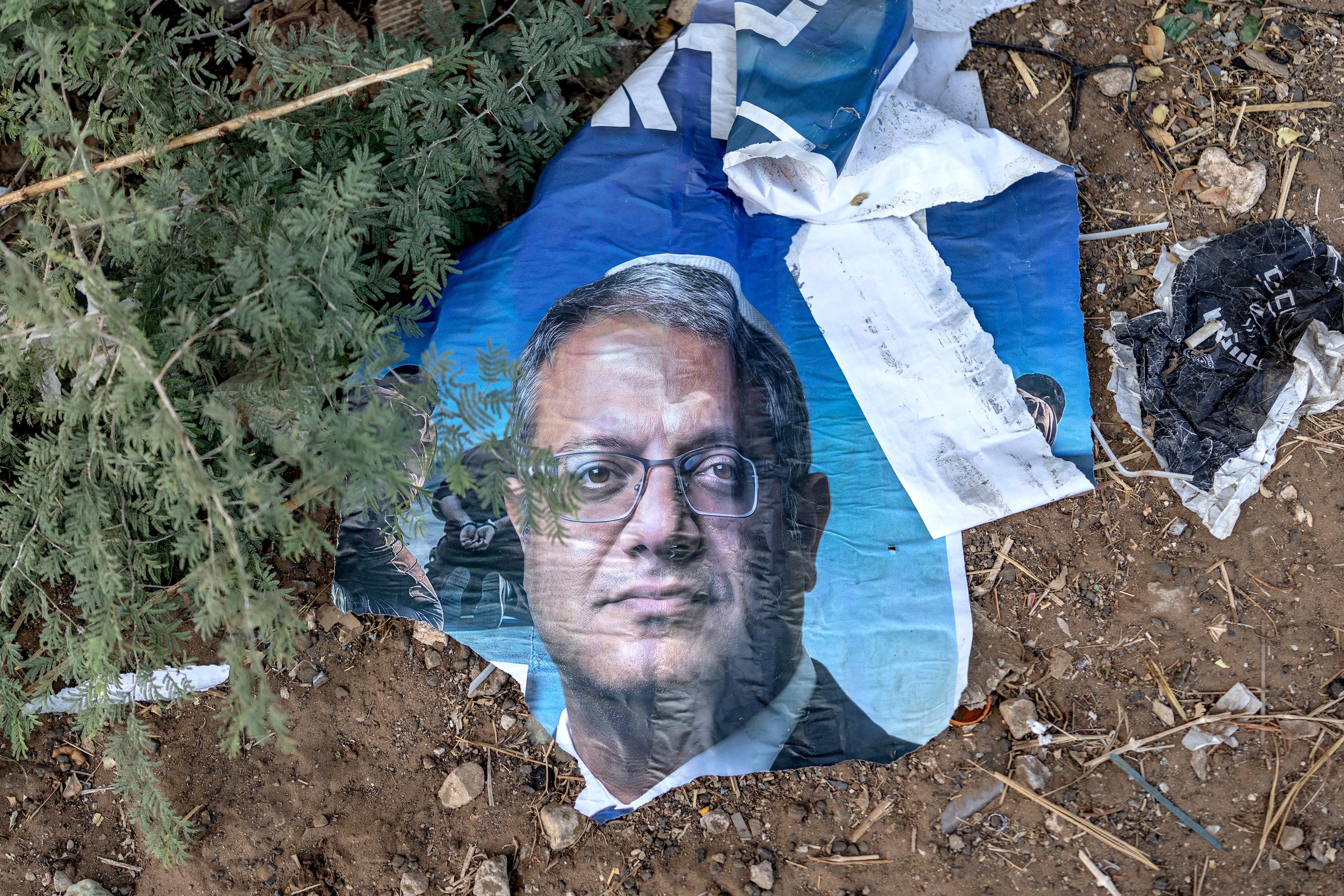 A torn up election banner for Israel's national security minister's Itamar Ben-Gvir far-right Otzma Yehudit (Jewish Power) party is displayed along the side of a highway outside Beit Shemesh in Israel's southern district on October 20, 2026.