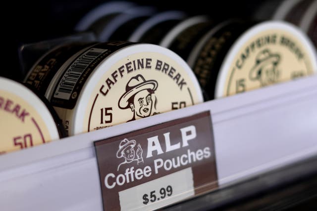 Containers of caffeine pouches