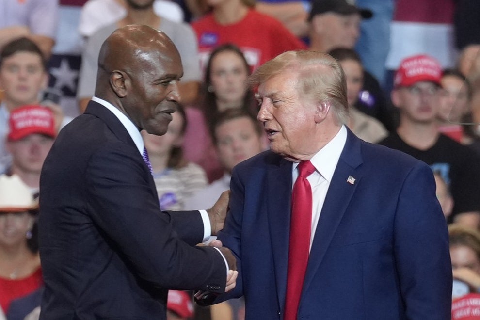 President Donald Trump welcomed retired boxer Evander Holyfield on stage to speak on his behalf in South Carolina Wednesday