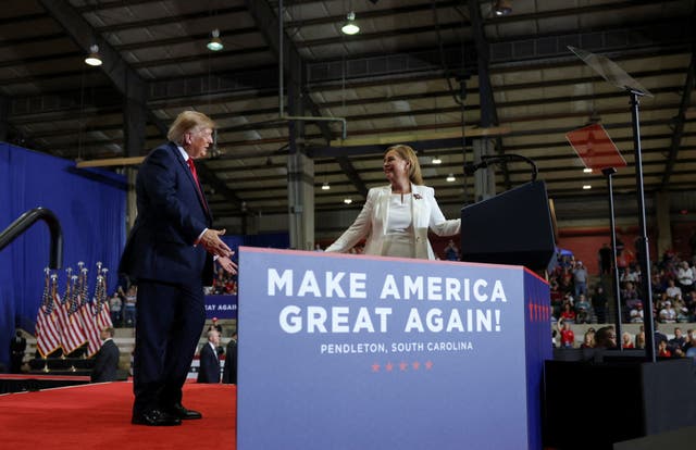 Trump shares the stage with Republican Senate candidate Darline Graham during a rally ahead of the midterms, at T. Ed Garrison Arena at Clemson University in Pendleton, South Carolina