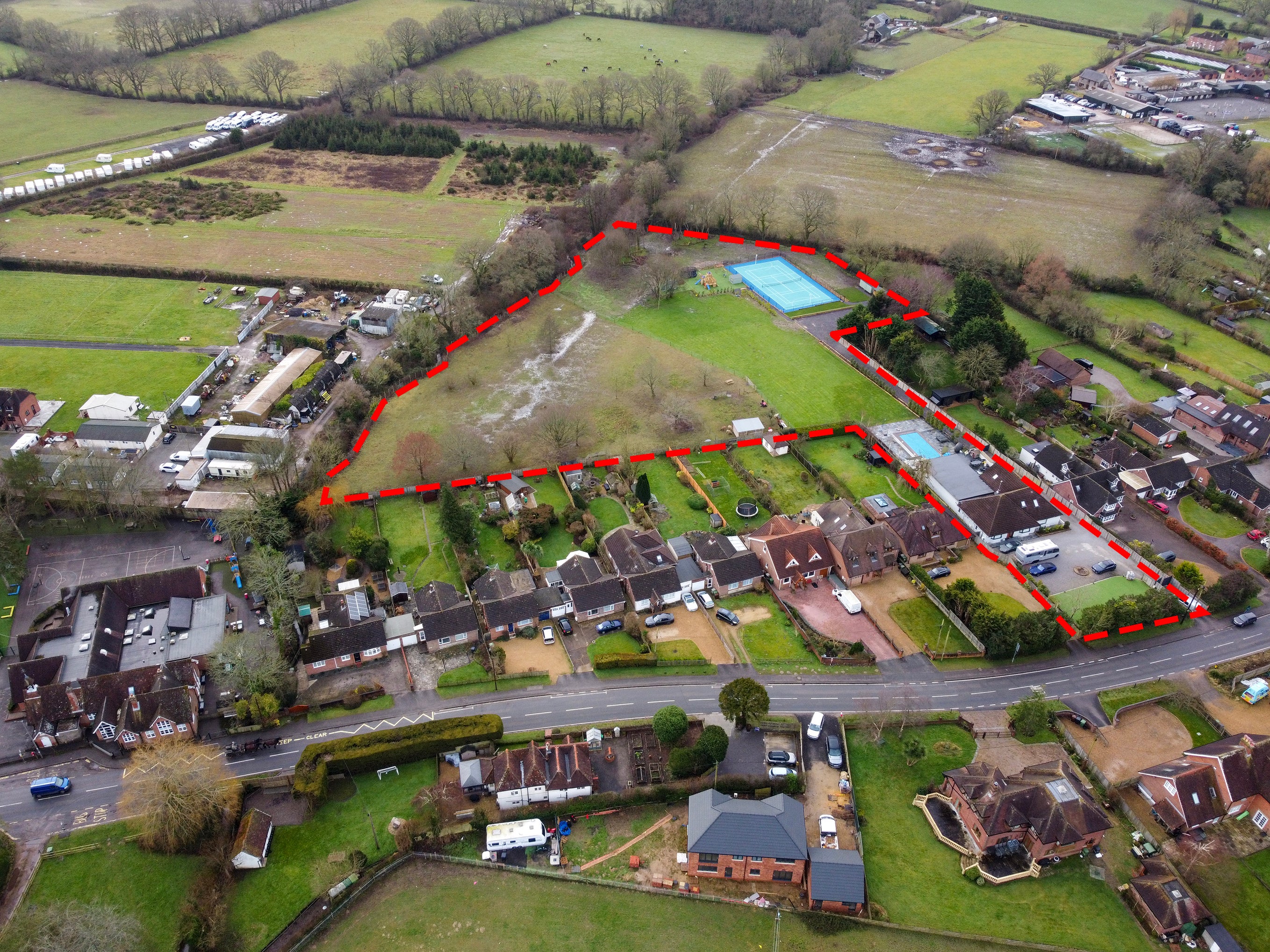 Mr Hepburn’s property, marked in red, with the bright blue tennis court