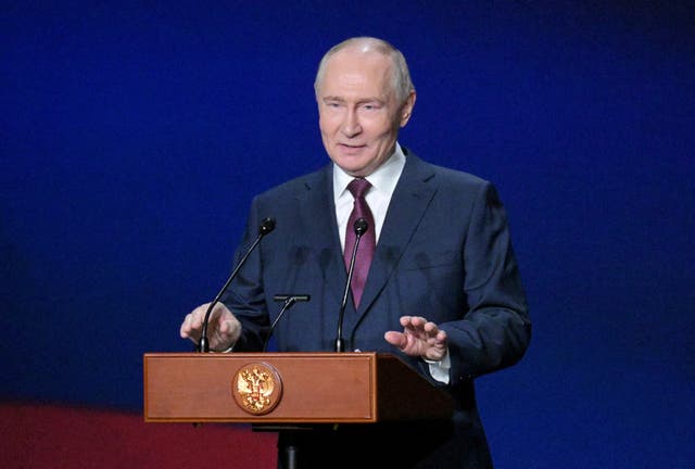 Russia's President Vladimir Putin delivers a speech during a festive event at the Bolshoi Theatre marking the 150th anniversary of Russia's Union of Theatre Workers in Moscow