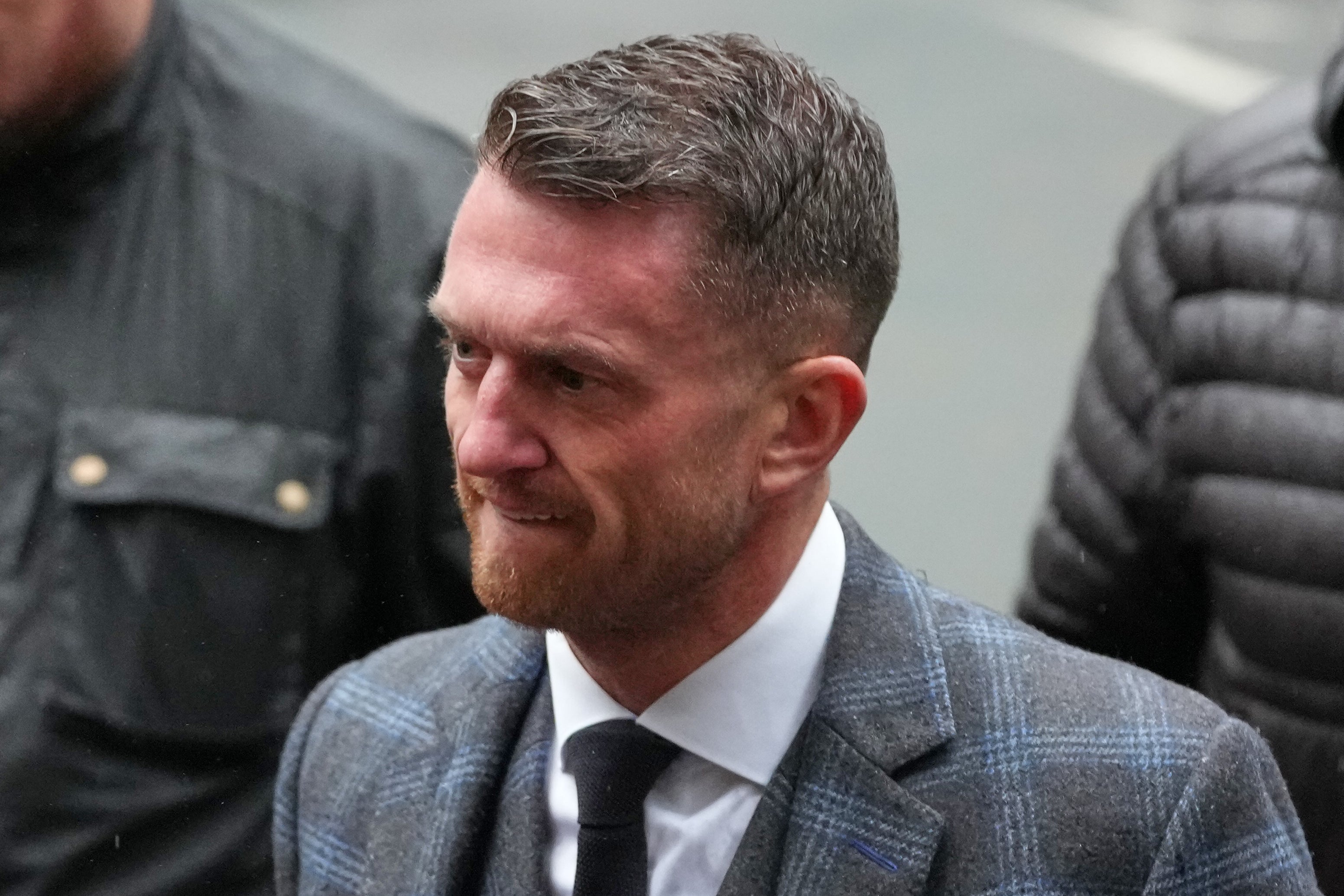 Tommy Robinson, who previously gave his name to the court as Stephen Lennon, is accused of harassing editor Jacob Dirnhuber and freelance journalist Andrew Young, causing them fear of violence, in August 2024