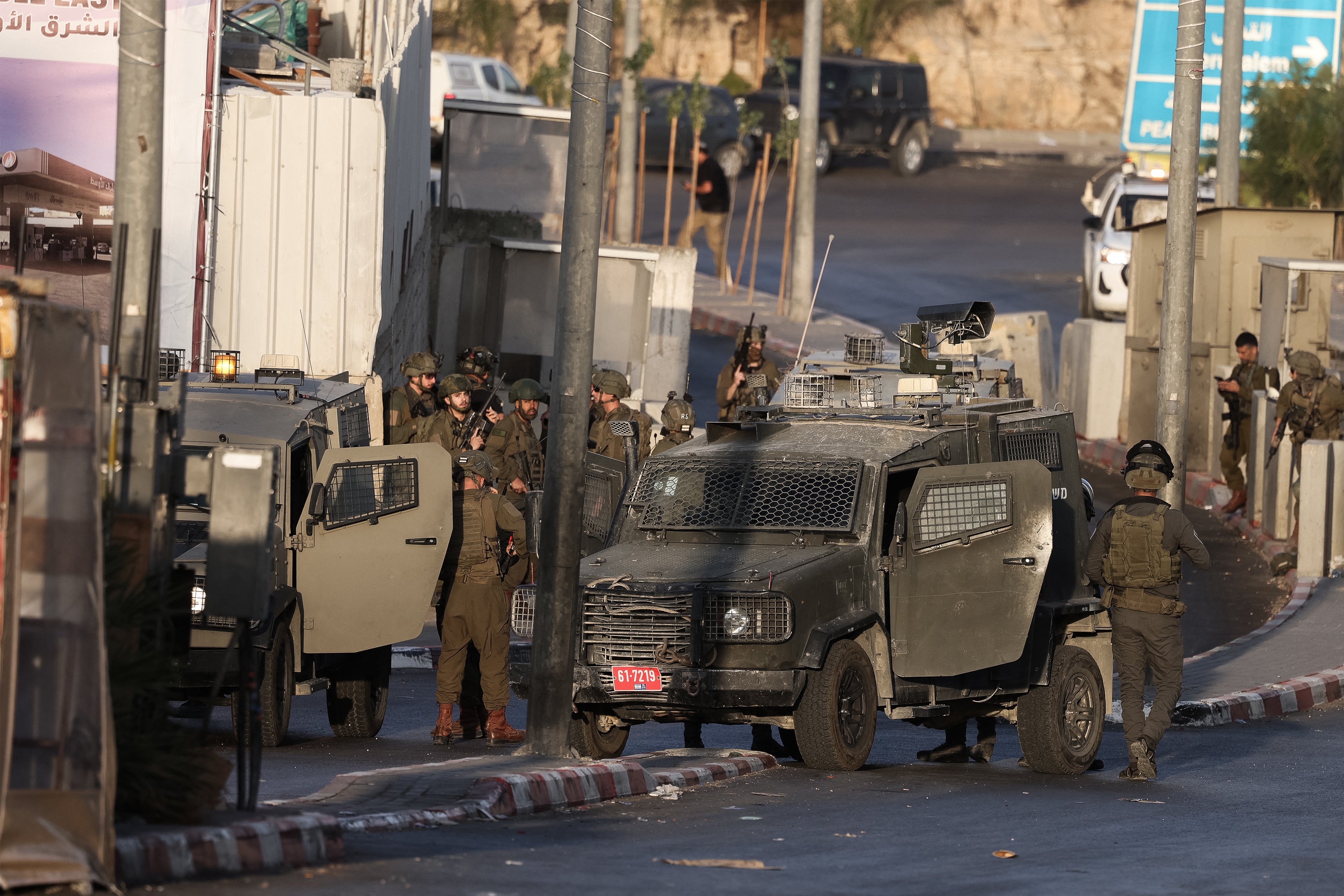 Israeli forces deploy at the scene following a fire exchange with two armed Palestinian men at the northern checkpoint of Hebron in the Israeli-occupied West Bank on October 23, 2026