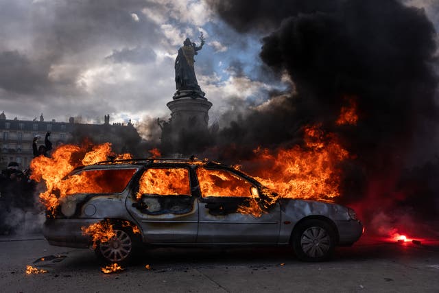 A car ablaze during demonstrations on October 17, 2026 in Paris, France