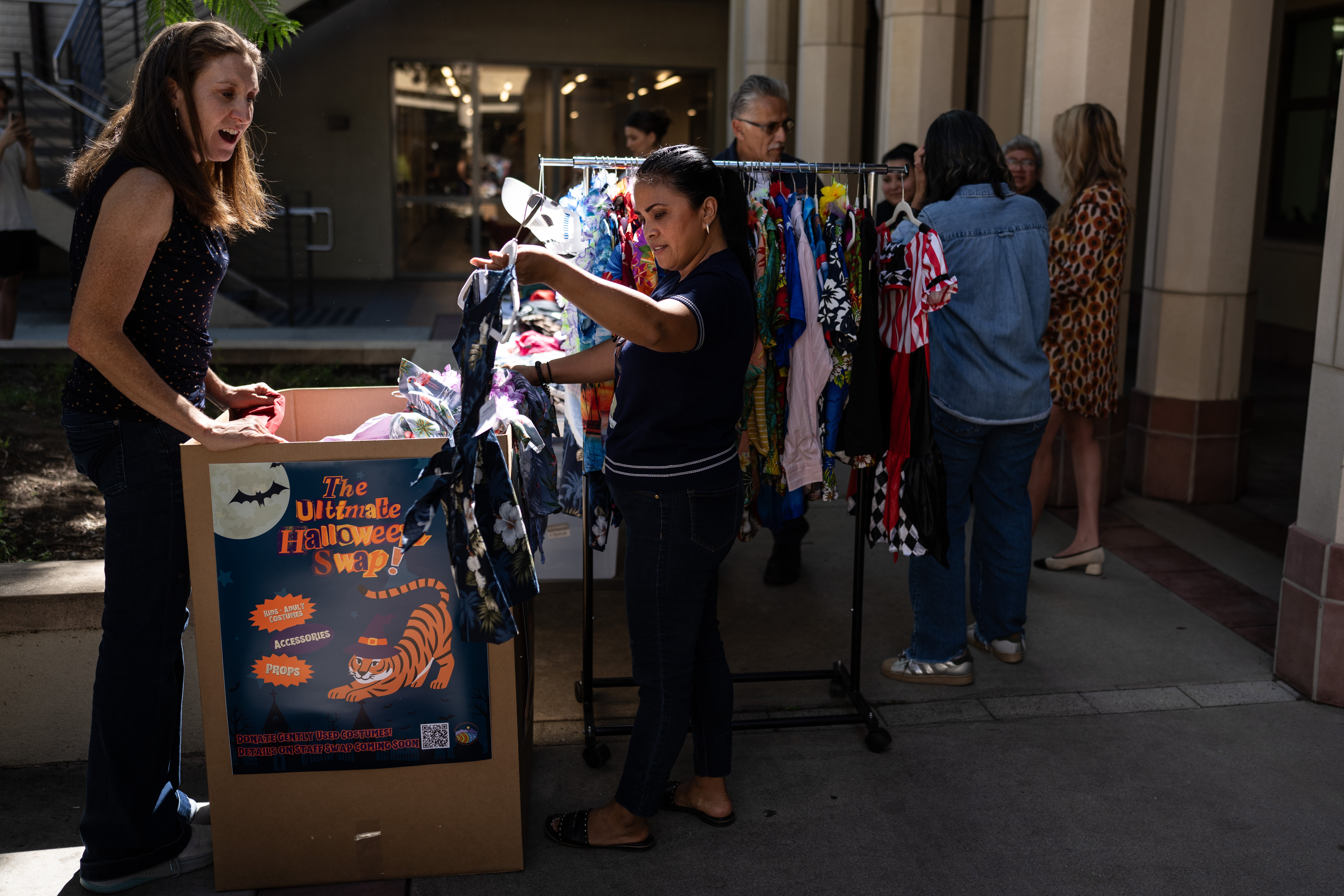 People gather at a Halloween costume swap at Occidental College in Los Angeles
