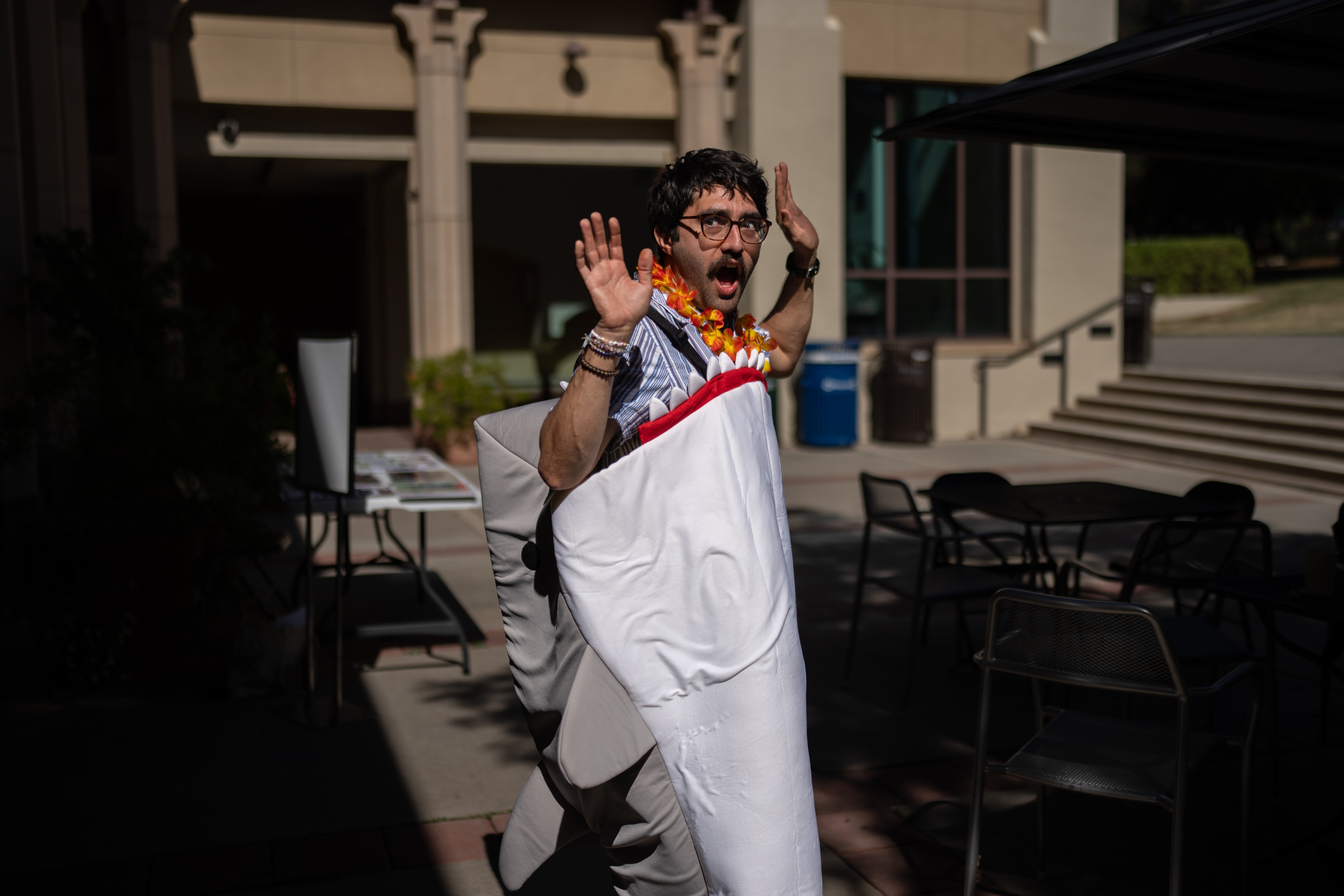 Braddock Sandoval, a chemistry professor at Occidental College, with a costume he picked out during a Halloween costume swap