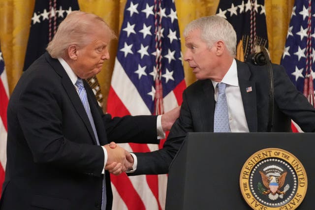 President Donald Trump shakes hands with Energy Secretary Chris Wright on May 4, 2026 at the White House in Washington