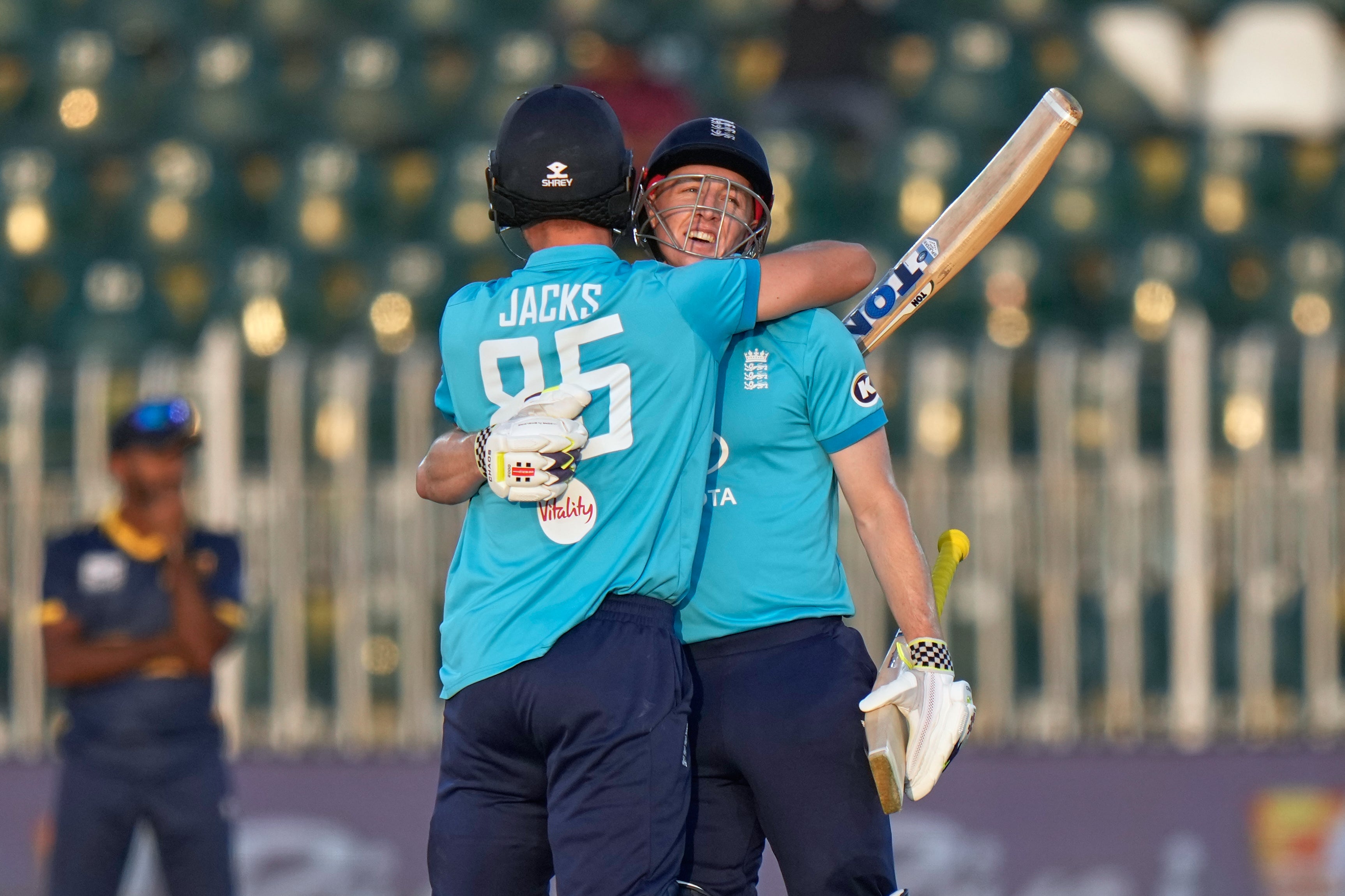 Harry Brook, right, hugs Will Jacks after bringing up his double hundred (Anjum Naveed/AP)