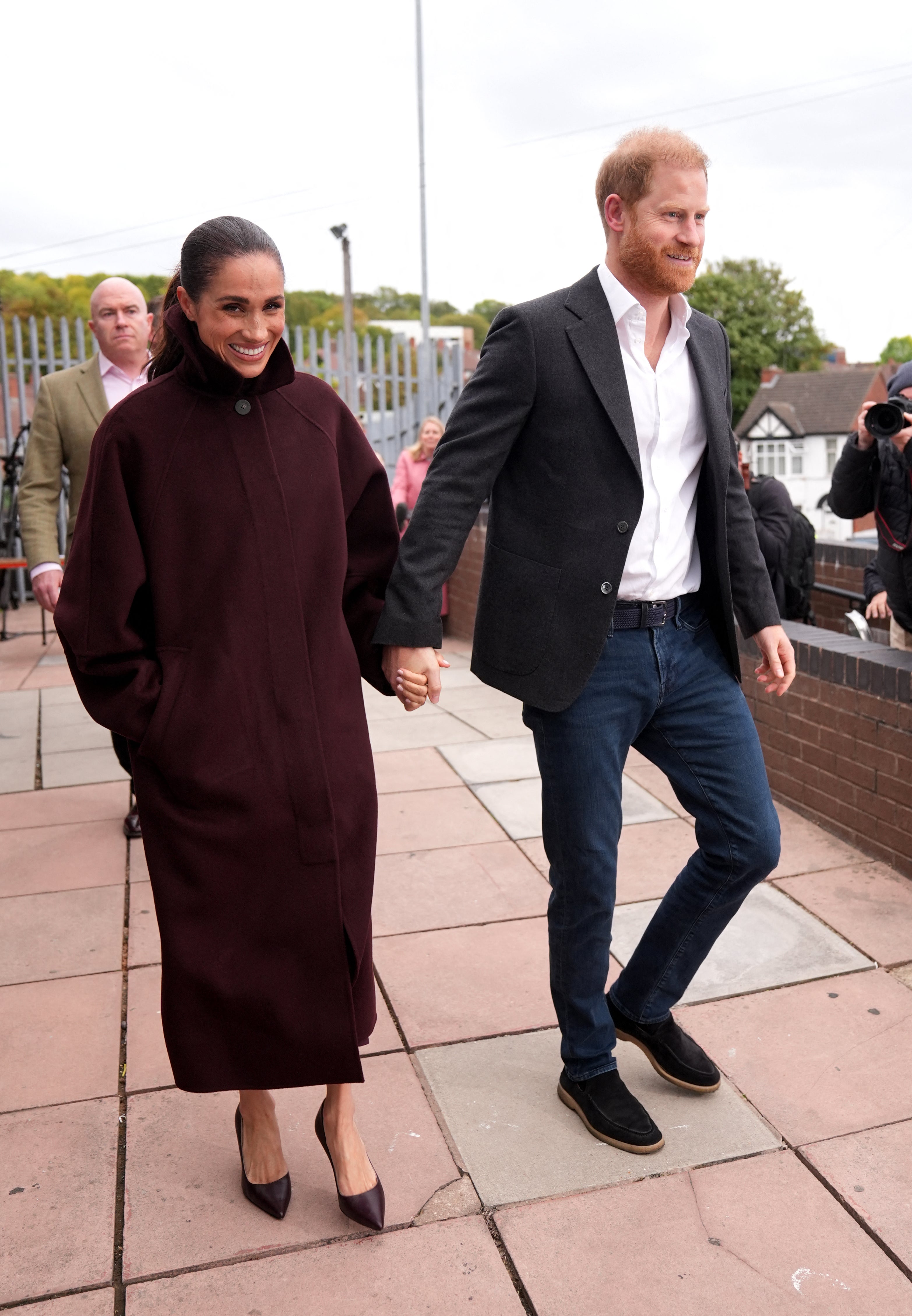 Britain's Prince Harry, Duke of Sussex and his wife Meghan, Duchess of Sussex, leave after a charity visit to Epic Partners in Nottingham last week